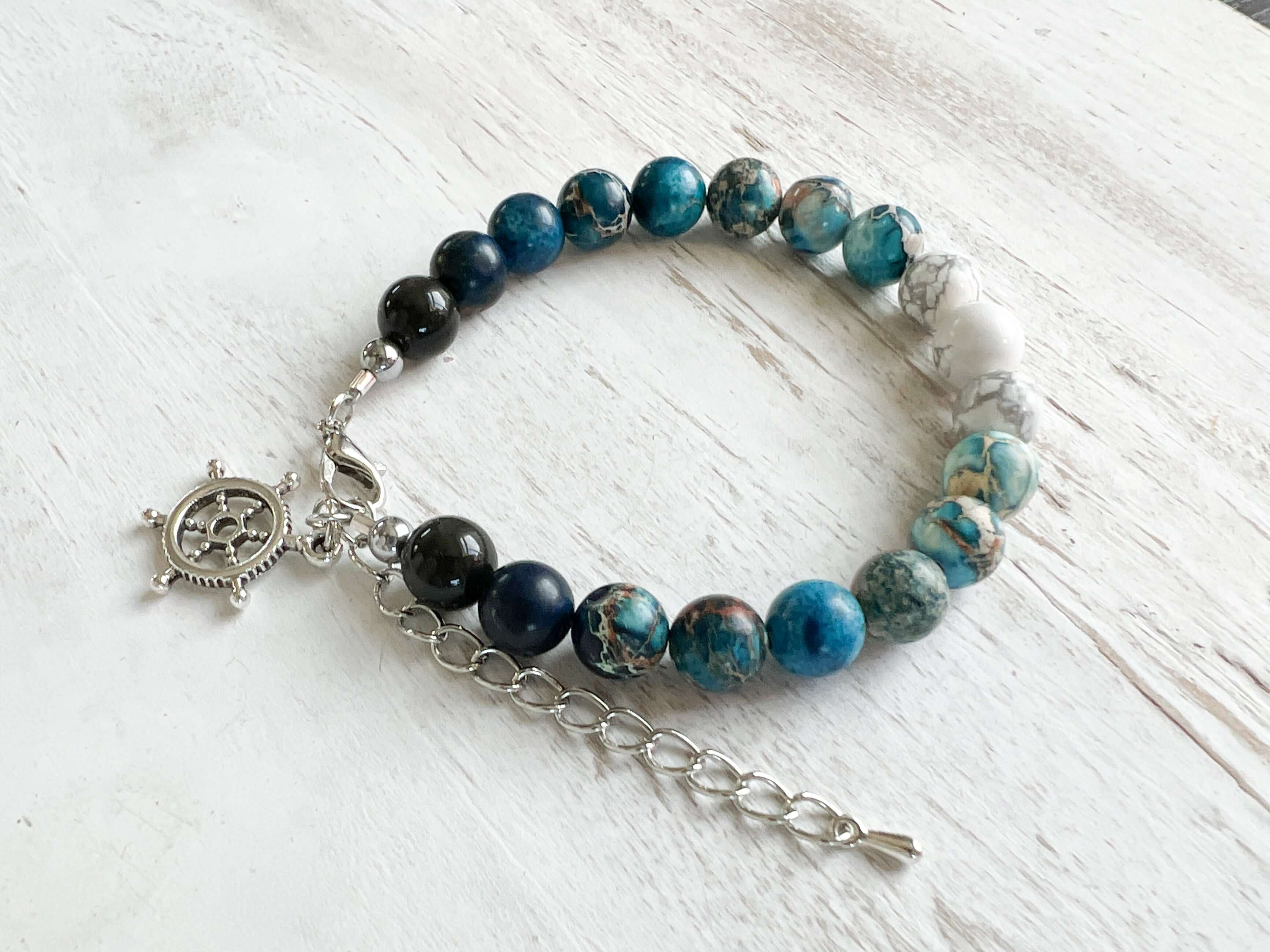 Water Element Bracelet This bracelet is made with black obsidian, dyed sea sediment jasper, and howlite. Together these stones dispel negative energy and open the wearer to emotional healing.