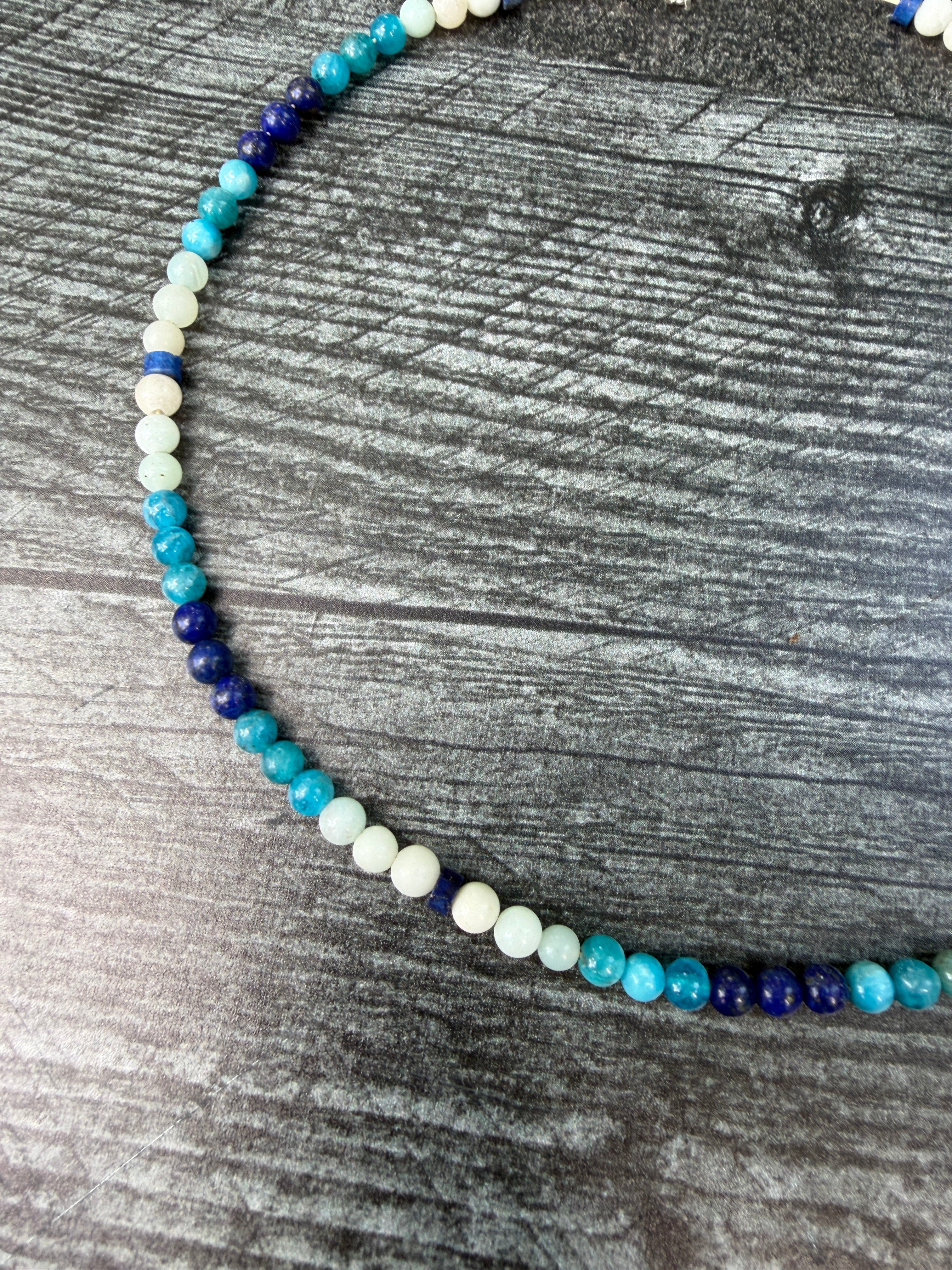 Close up of beaded necklace made with Apatite, Lapis Lazuli, and Amazonite