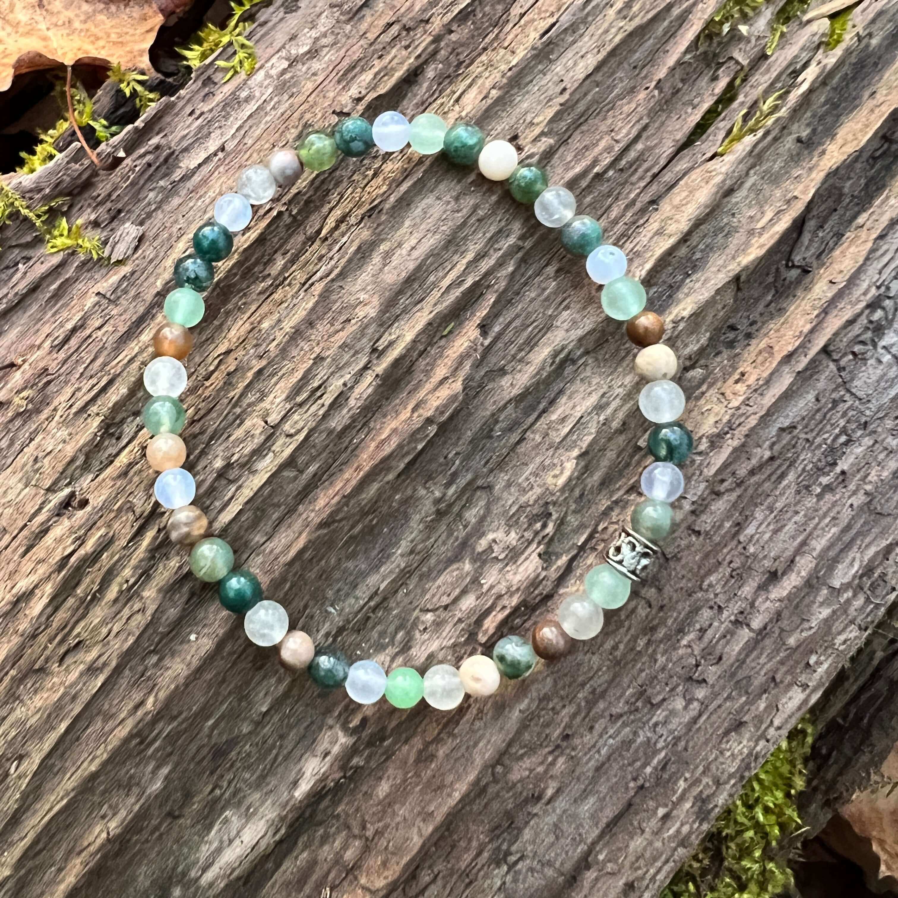 Dappled Sunlight Bracelet This bracelet is made with high-quality Moss Agate, Green Aventurine, Aquamarine, Cloud Quartz & Wood Opal stones which bring abundance and calm to the wearer. Zodiac: Virgo, Taurus, Pisces, Aries, Aquarius & Leo Chakras: Heart,