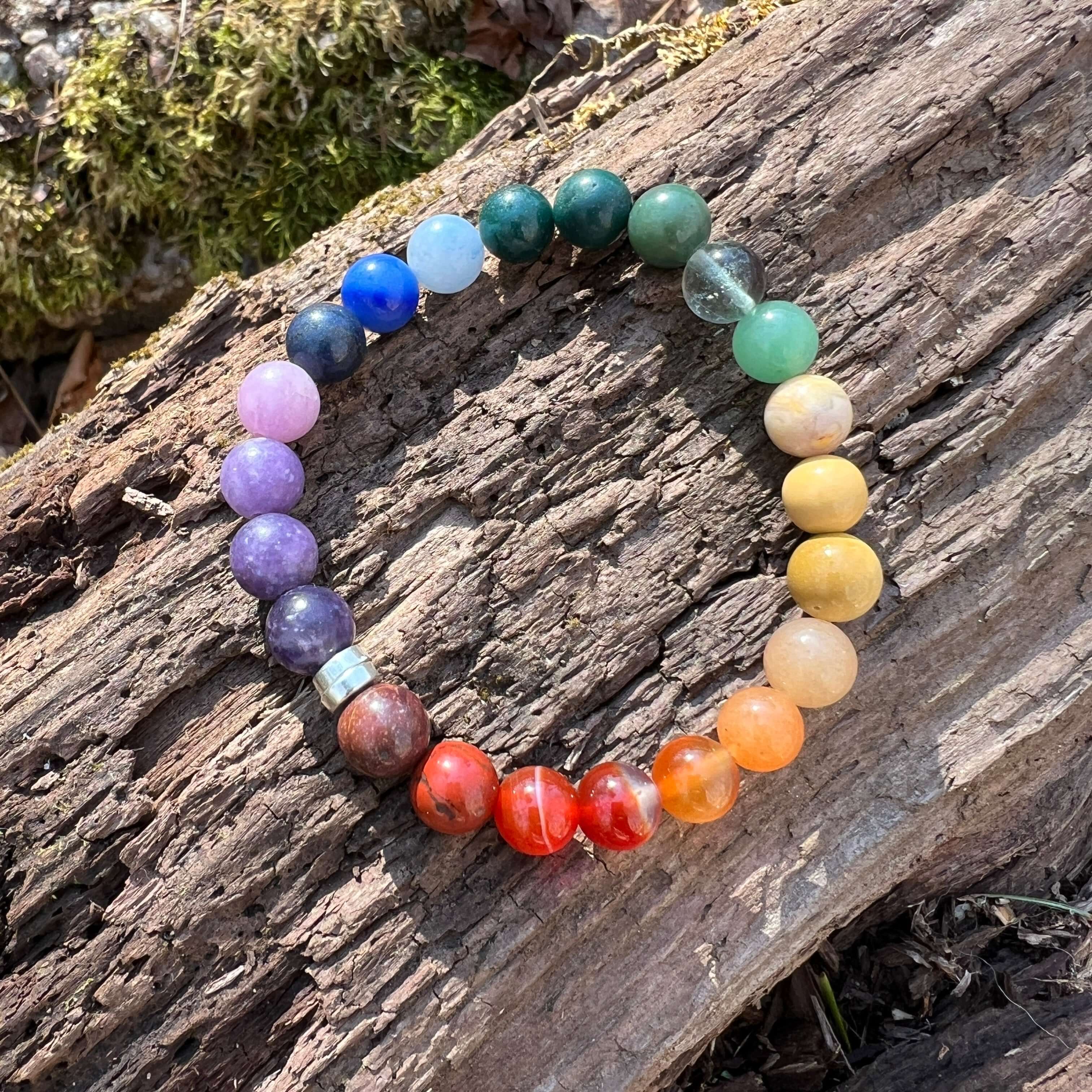 Rainbow Love Bracelet with a wood background