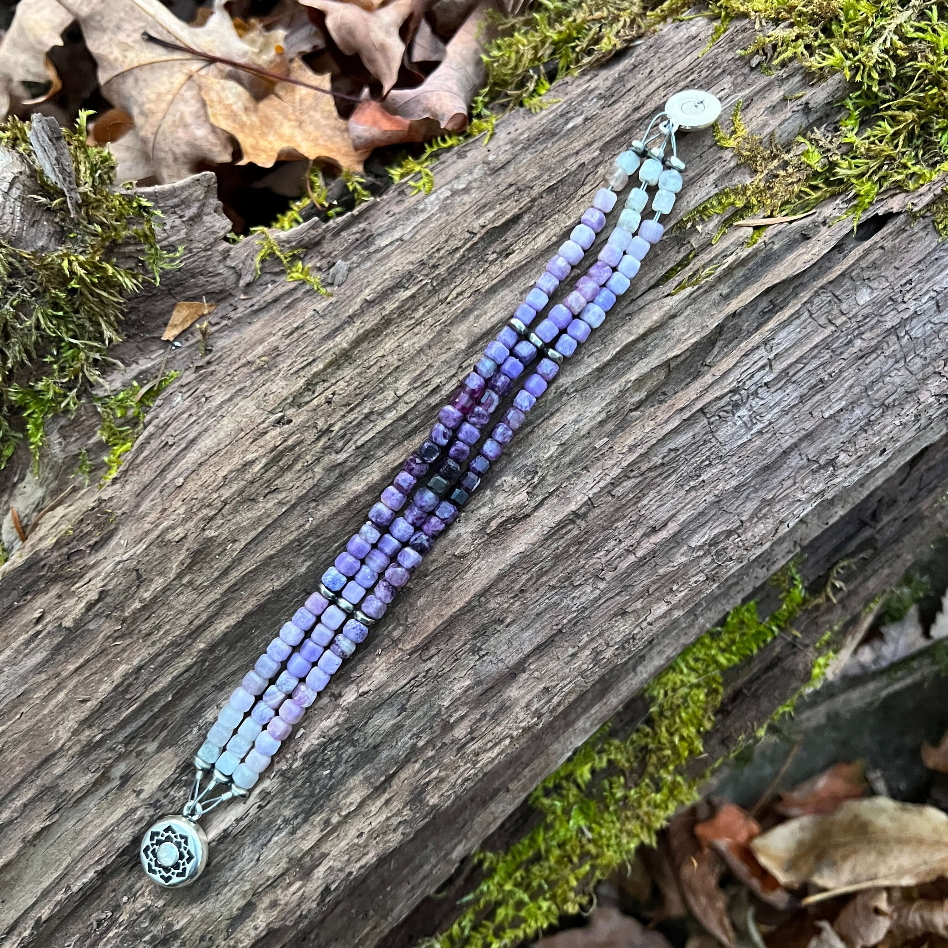 Silky Fluorite Stacked Bracelet Silky Fluorite is a rare form of Fluorite with a silky opaque luster. The luster appearance is from quartz inclusions. These quartz inclusions influence the passing of light through the mineral thus creating a silky, fibrou