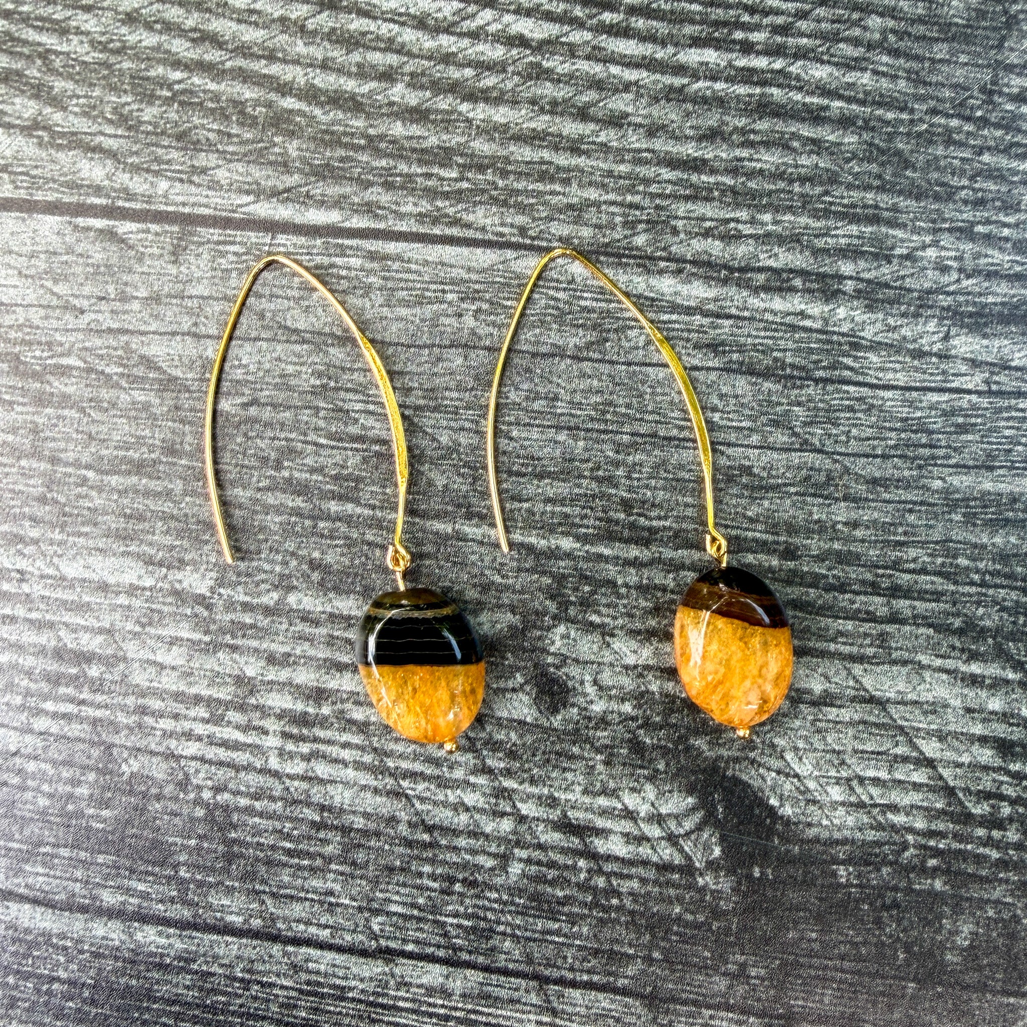 Handcrafted Bumblebee Agate earrings with natural oval gemstones on gold-plated stainless steel elongated ear wires