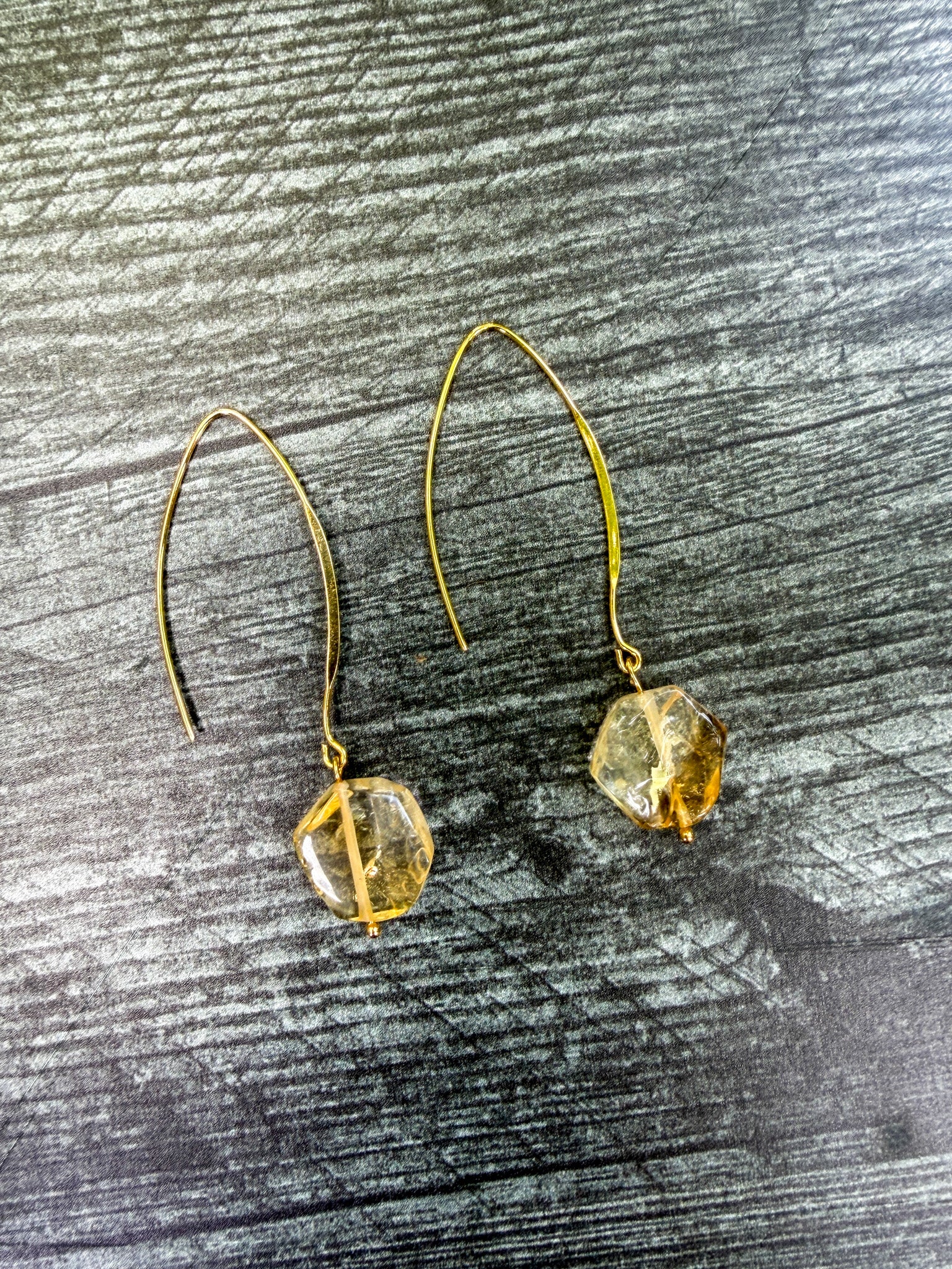 Pair of handcrafted Citrine earrings with natural hand-carved hexagon gemstones and gold-plated ear wires