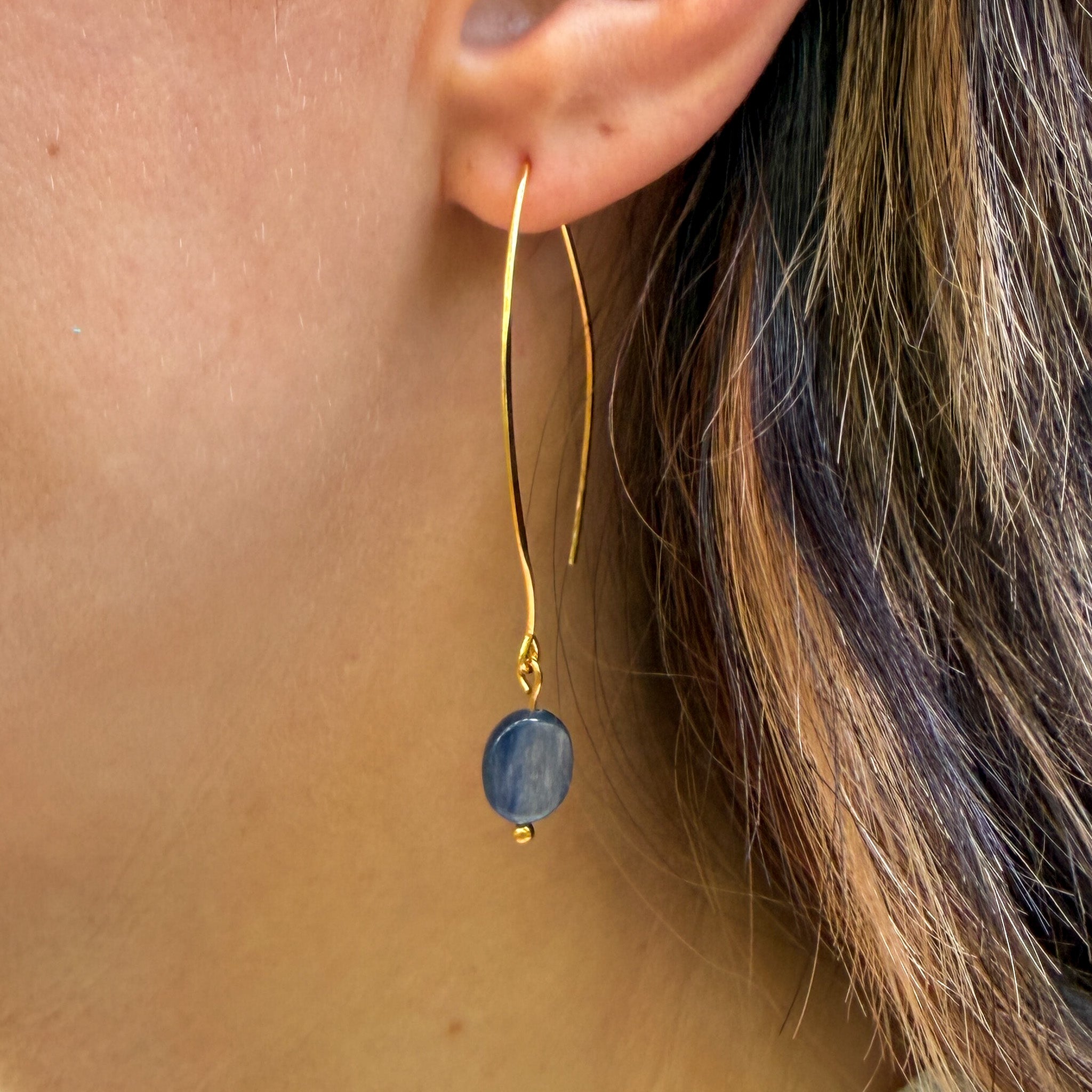 Grade AAA Kyanite earring with gold-plated elongated ear wires on model