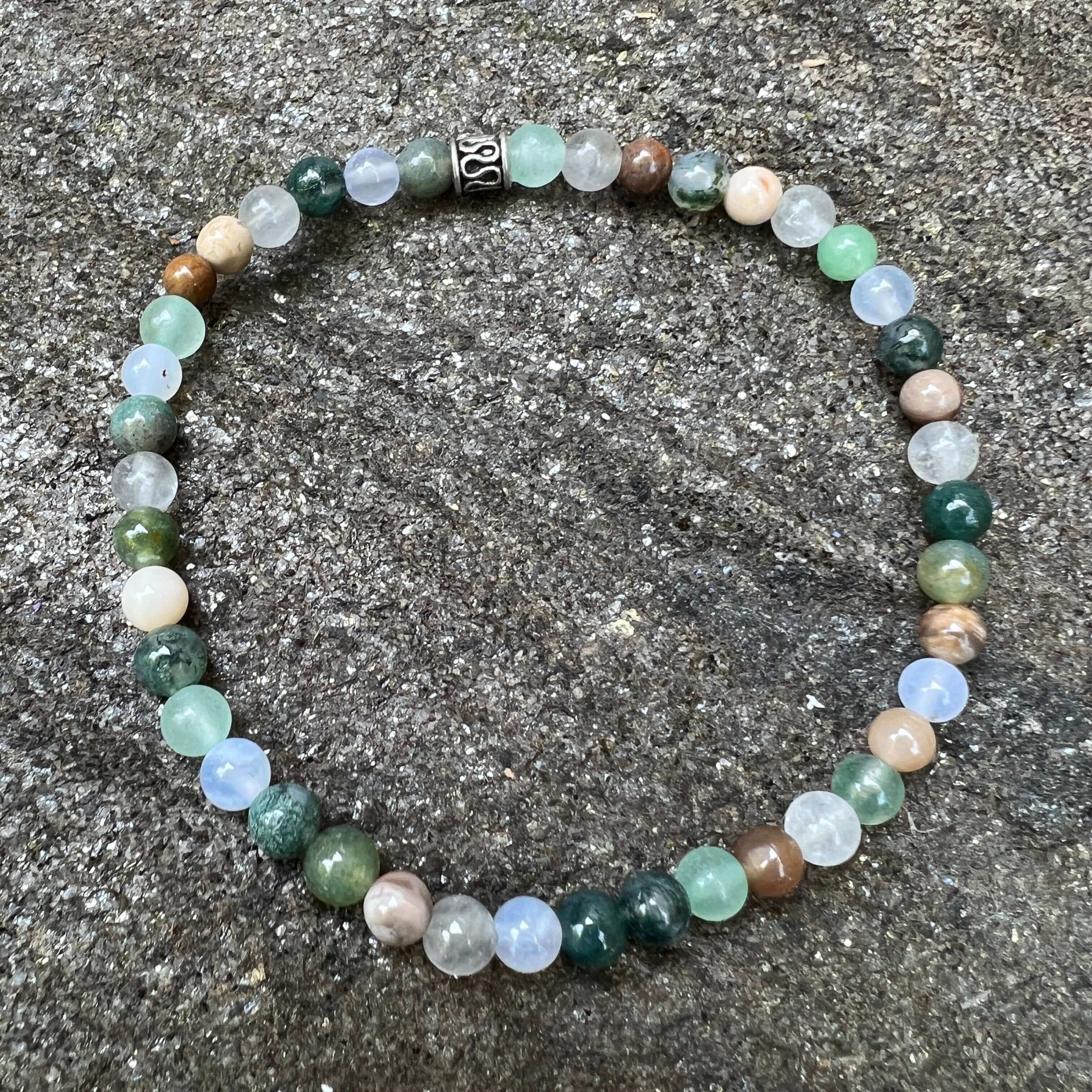 Dappled Sunlight Bracelet This bracelet is made with high-quality Moss Agate, Green Aventurine, Aquamarine, Cloud Quartz & Wood Opal stones which bring abundance and calm to the wearer. Zodiac: Virgo, Taurus, Pisces, Aries, Aquarius & Leo Chakras: Heart,