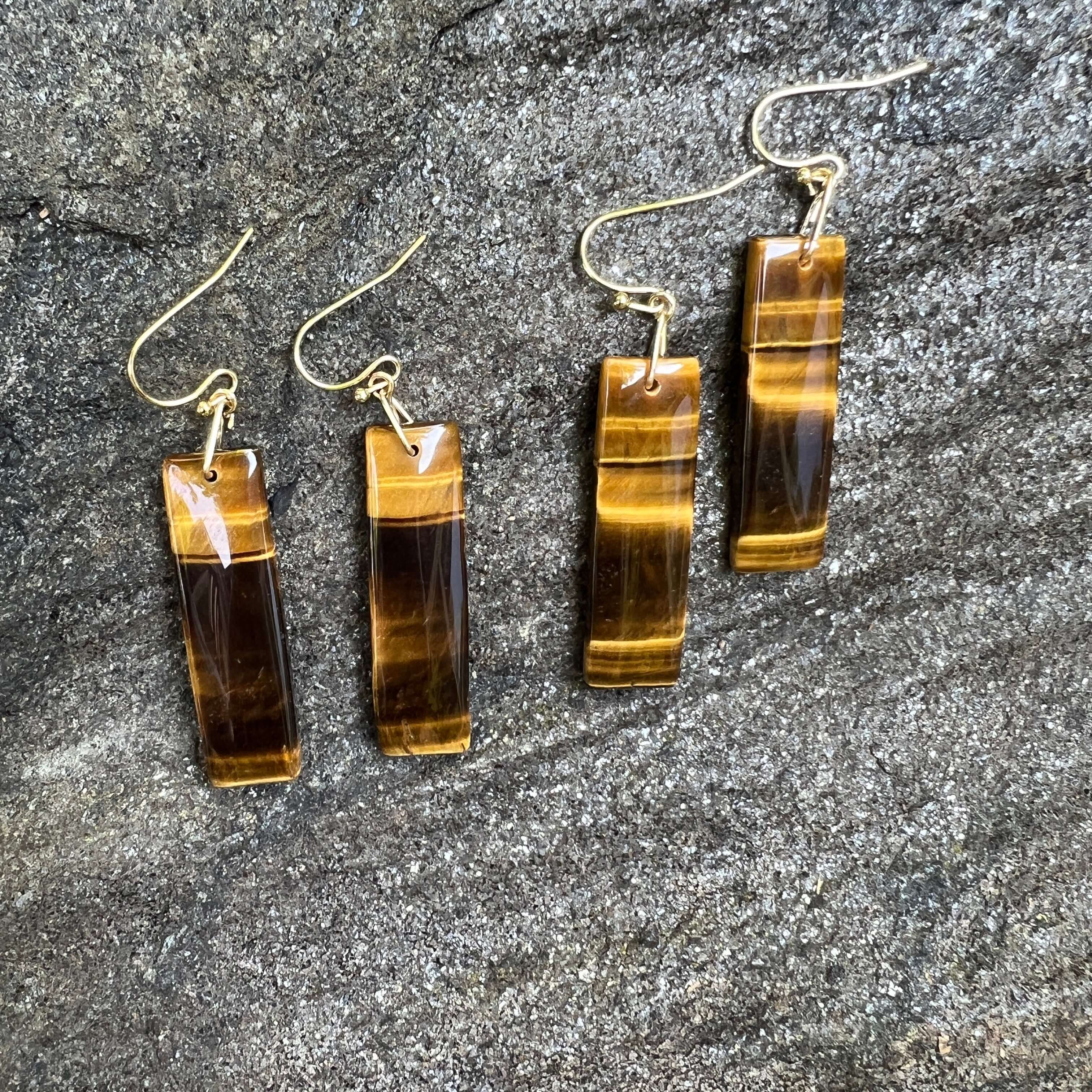 Tiger Eye Earrings These earrings are made with high-quality Tiger Eye stones which bring protection and connection to the wearer. Zodiac Signs: Leo and Capricorn Chakras: Sacral, Solar Plexus, and Third Eye. Handmade with authentic crystals and gemstones