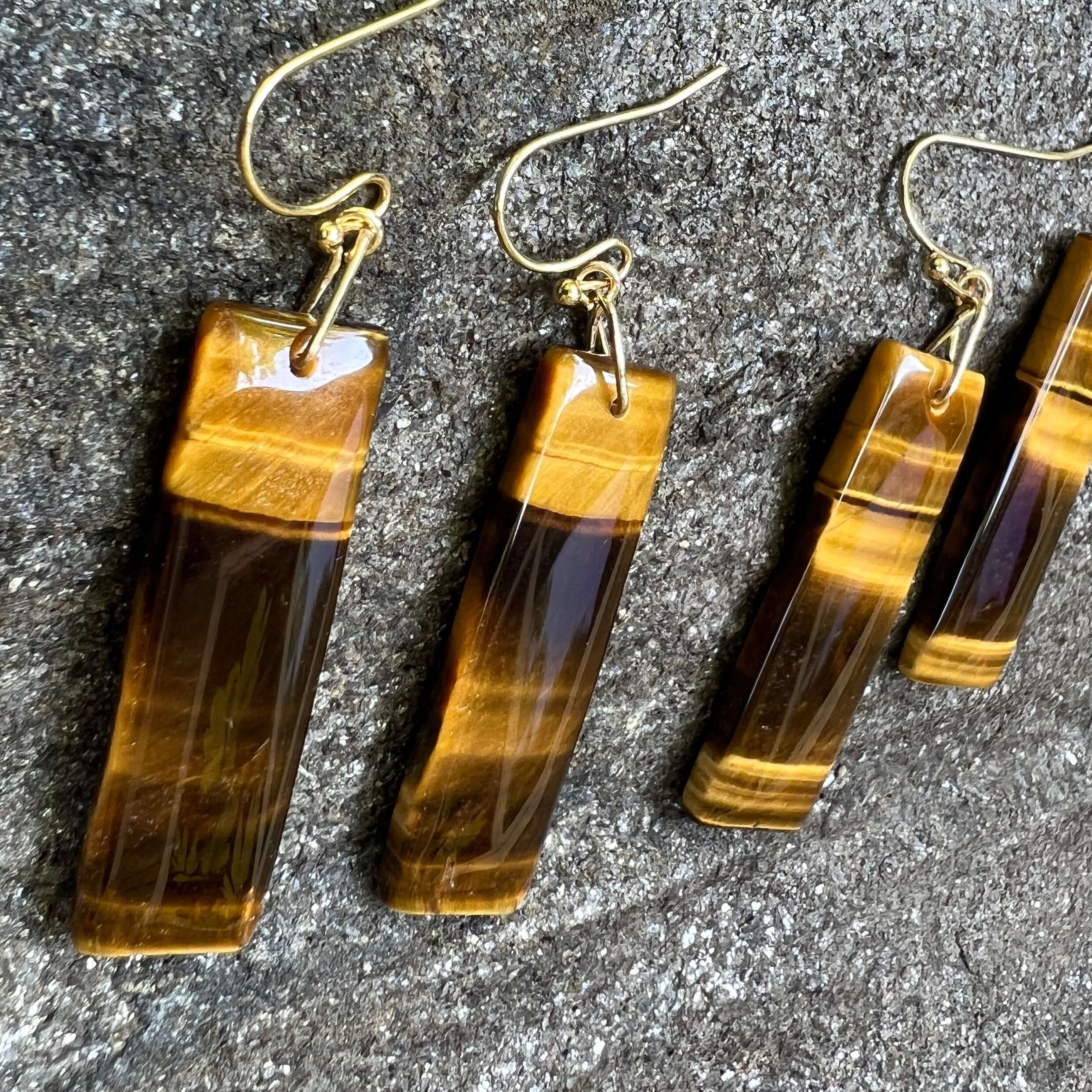Tiger Eye Earrings These earrings are made with high-quality Tiger Eye stones which bring protection and connection to the wearer. Zodiac Signs: Leo and Capricorn Chakras: Sacral, Solar Plexus, and Third Eye. Handmade with authentic crystals and gemstones