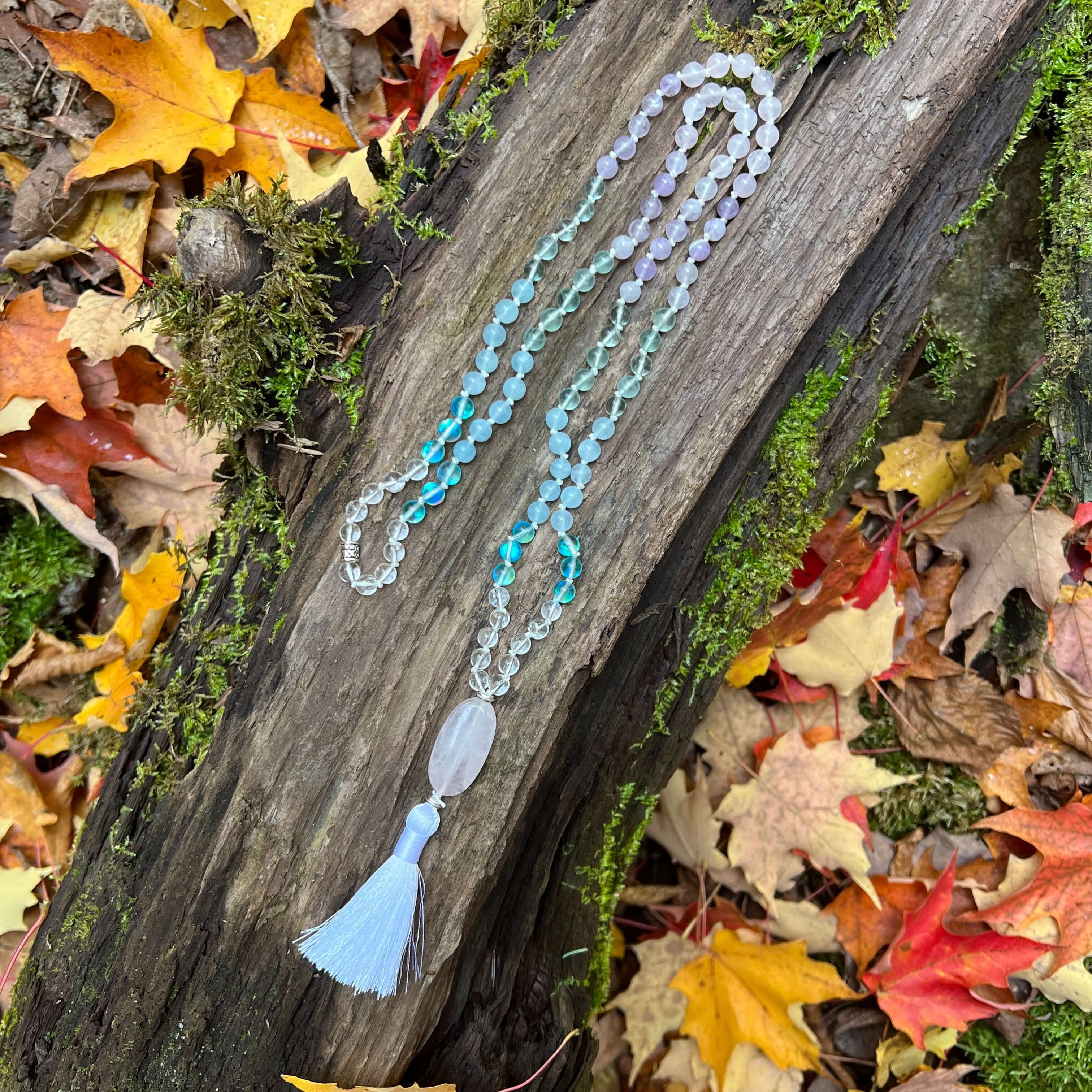 Clarity Mala with a woodland background.