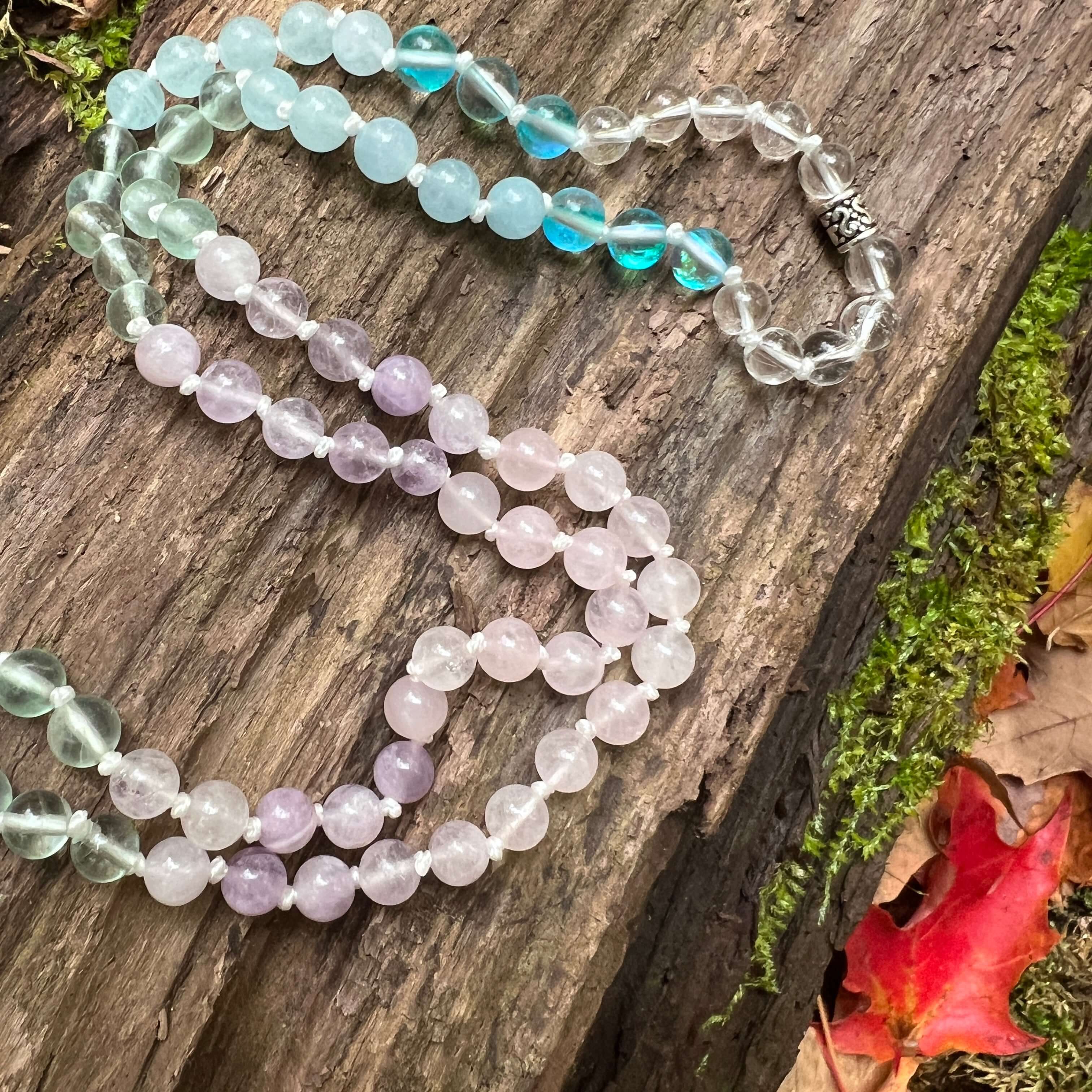 Clarity Mala with a woodland background.