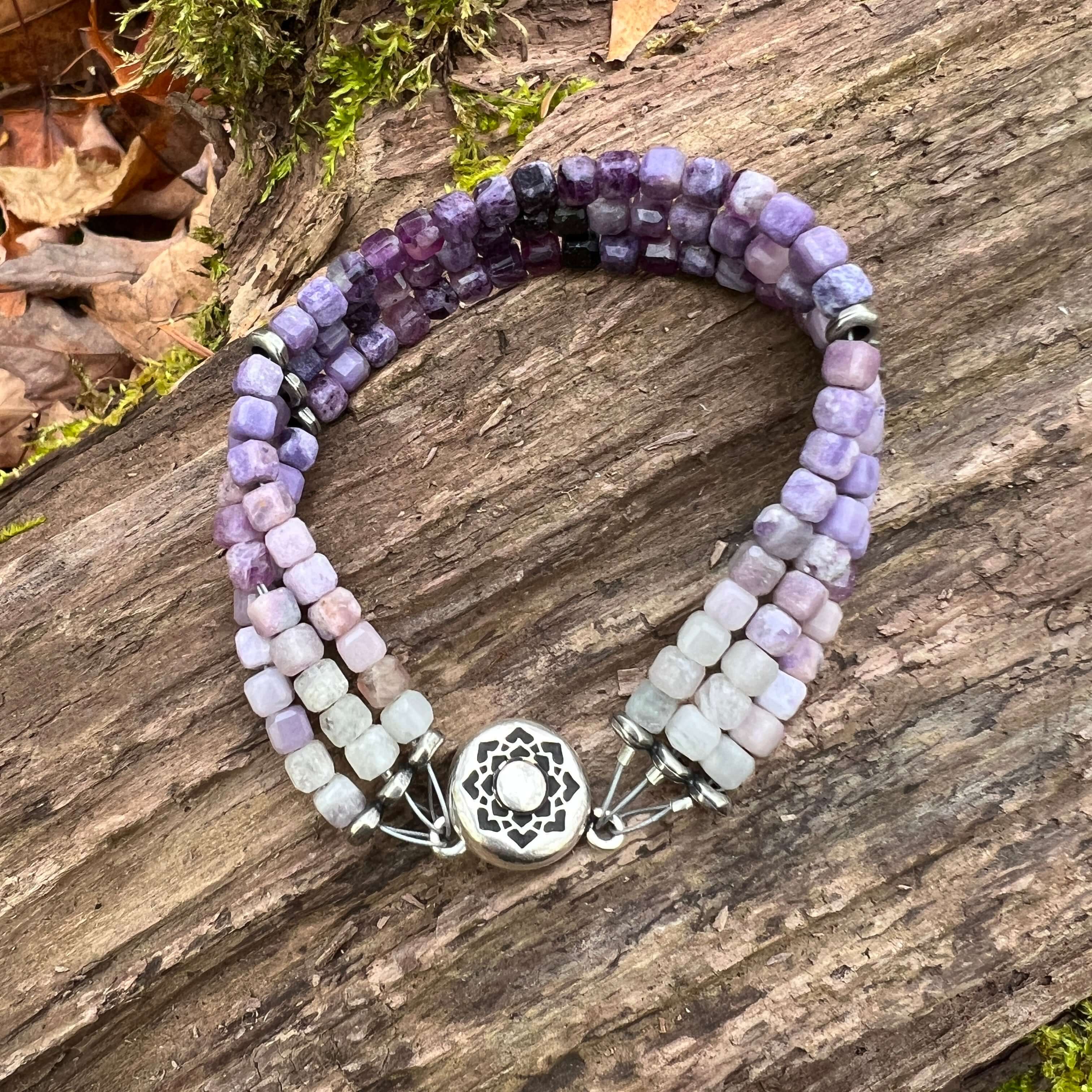 Silky Fluorite Stacked Bracelet Silky Fluorite is a rare form of Fluorite with a silky opaque luster. The luster appearance is from quartz inclusions. These quartz inclusions influence the passing of light through the mineral thus creating a silky, fibrou