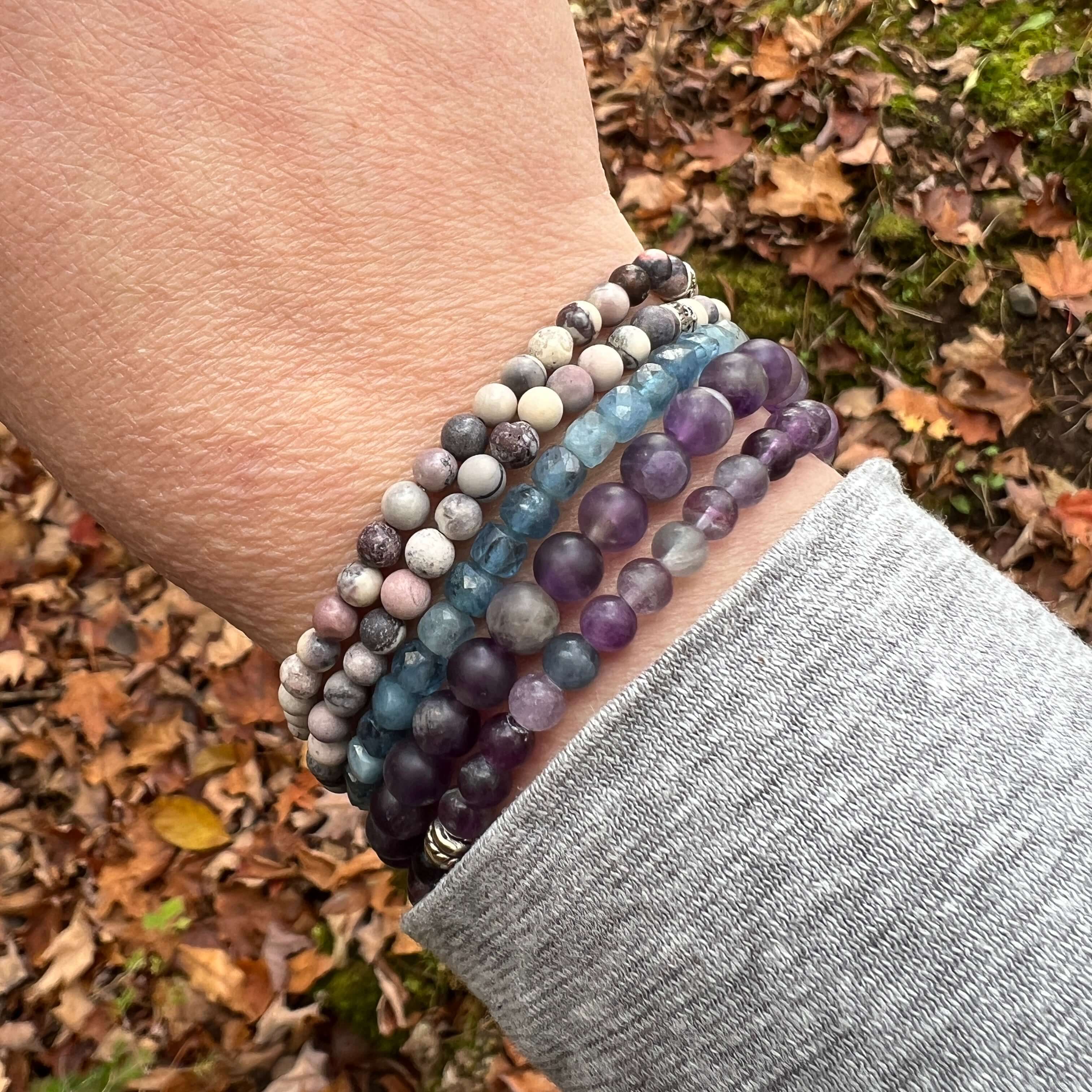 model wearing multiple bracelets including two Porcelain Jasper mini bracelets in in both matte and polished finish