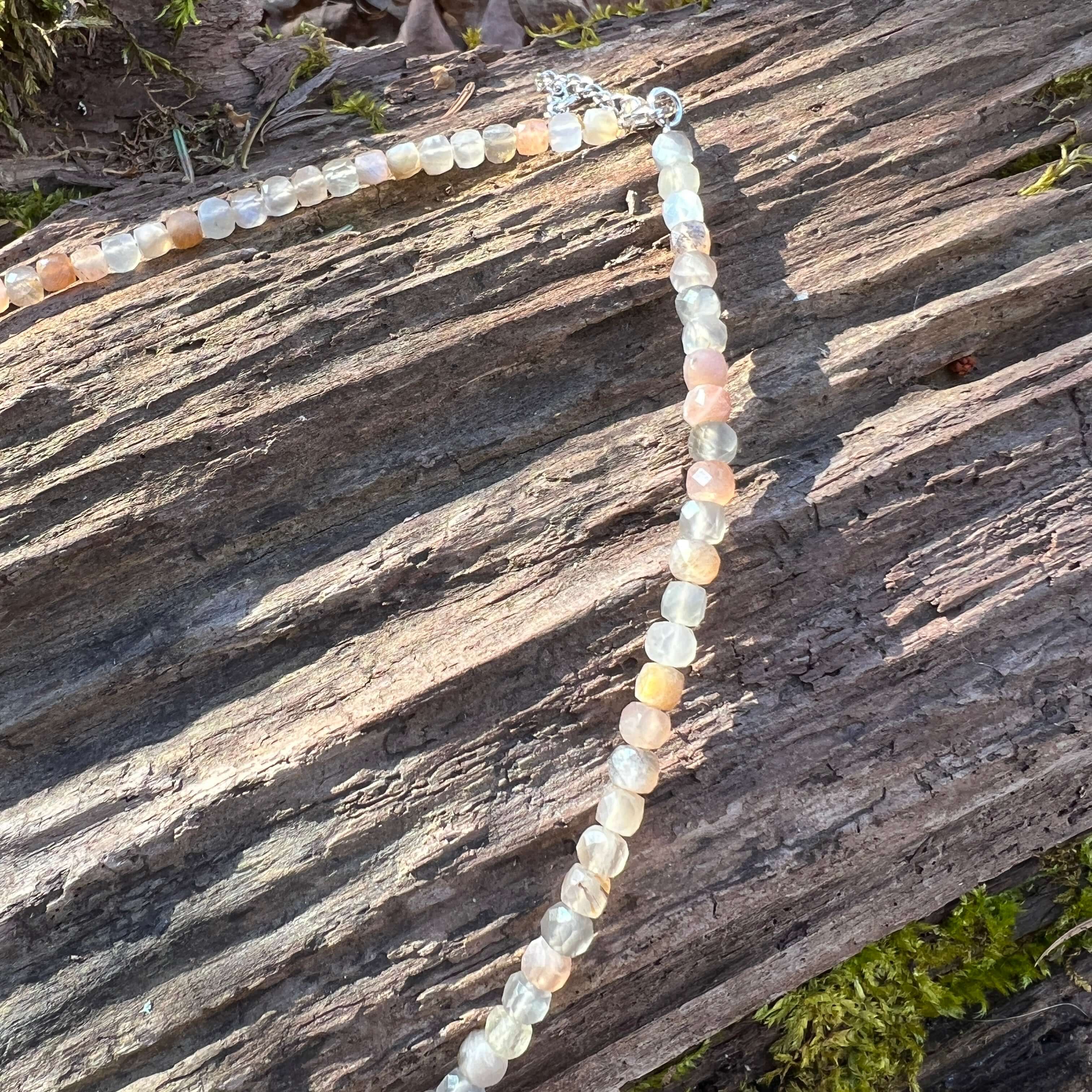 Moonstone Cube Necklace This necklace is made with high-quality Moonstone beads which bring inner growth to the wearer. A stone for “new beginnings”, Moonstone is a stone of inner growth and strength. It soothes emotional instability and stress, and stabi