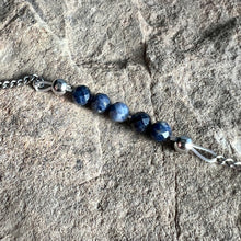Load image into Gallery viewer, Close up of September birthstone bracelet made with 4mm Sapphire on stainless steel chain.
