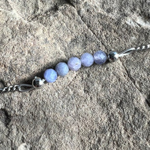Load image into Gallery viewer, Close up of December birthstone bracelet made with 4mm faceted Tanzanite on stainless steel chain.
