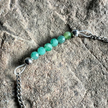 Load image into Gallery viewer, Close up of May birthstone bracelet made with 3mm Columbian Emeralds on stainless steel chain.

