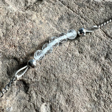 Load image into Gallery viewer, Close up of April birthstone bracelet made with White Topaz on stainless steel chain.
