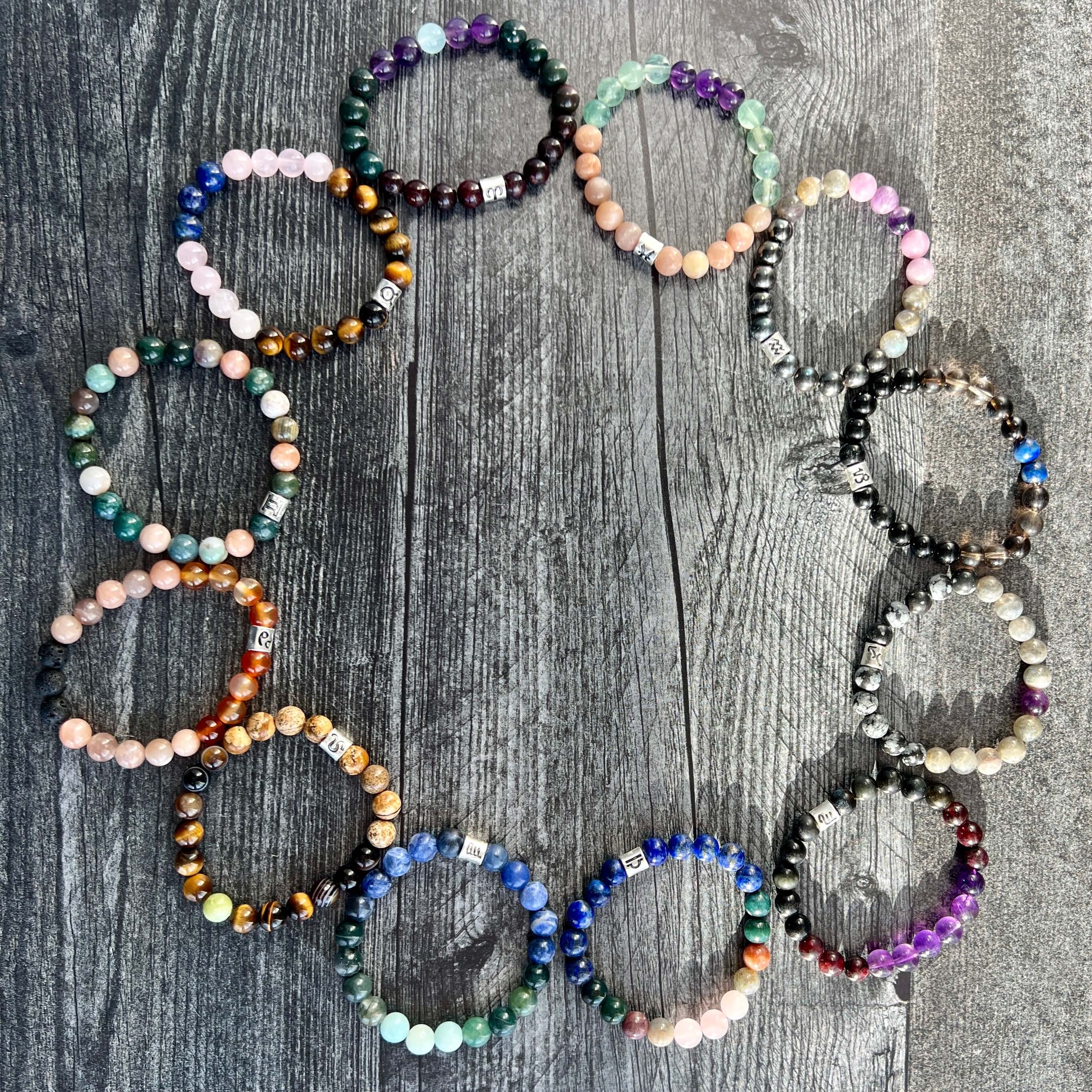 Aquarius Zodiac Bracelet The Aquarius Zodiac Bracelet is created with a combination of Amethyst, Lepidolite, Hematite, and Labradorite beads, which resonate with the versatile and expressive qualities associated with this zodiac sign.