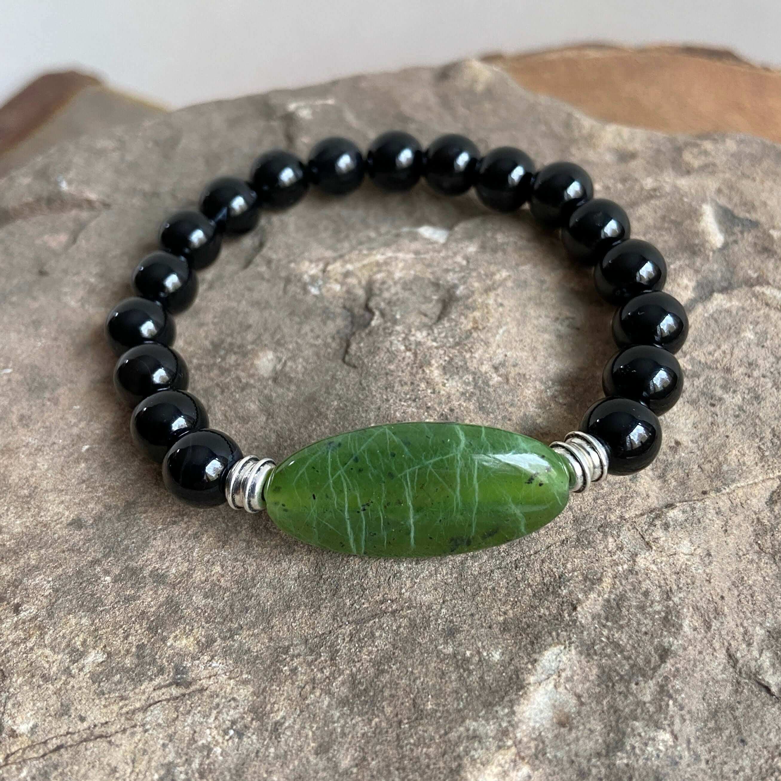 Jade Focal Bracelet This bracelet is made with high-quality Jade and either Black Onyx or Obsidian stones which bring calm and insight to the wearer. Zodiac Signs: Capricorn, Gemini, Libra, Taurus, and Virgo. Chakra: Heart. Handmade with authentic crystal