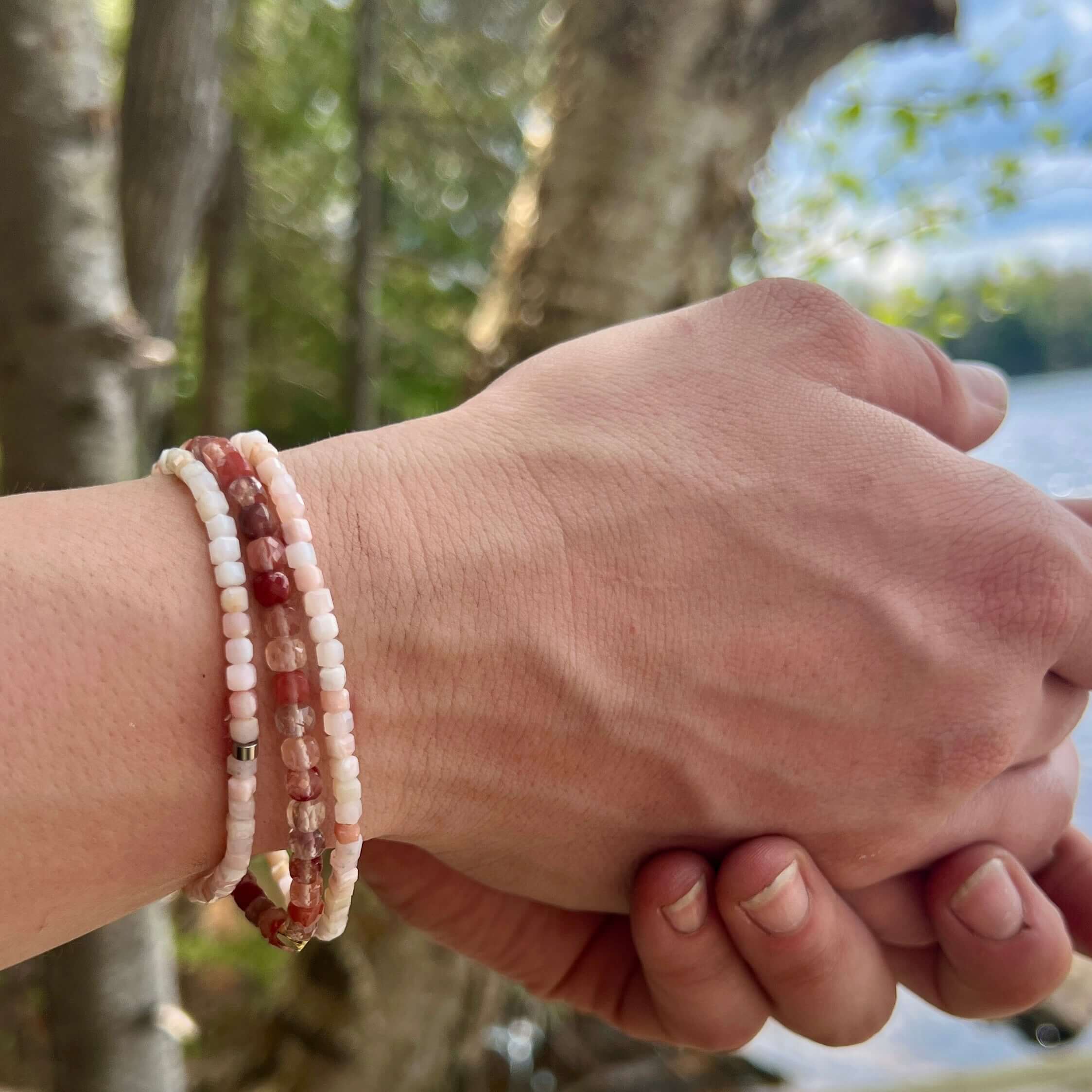 Peruvian Pink Opal bracelets and Red Lazasine bracelet on hand model