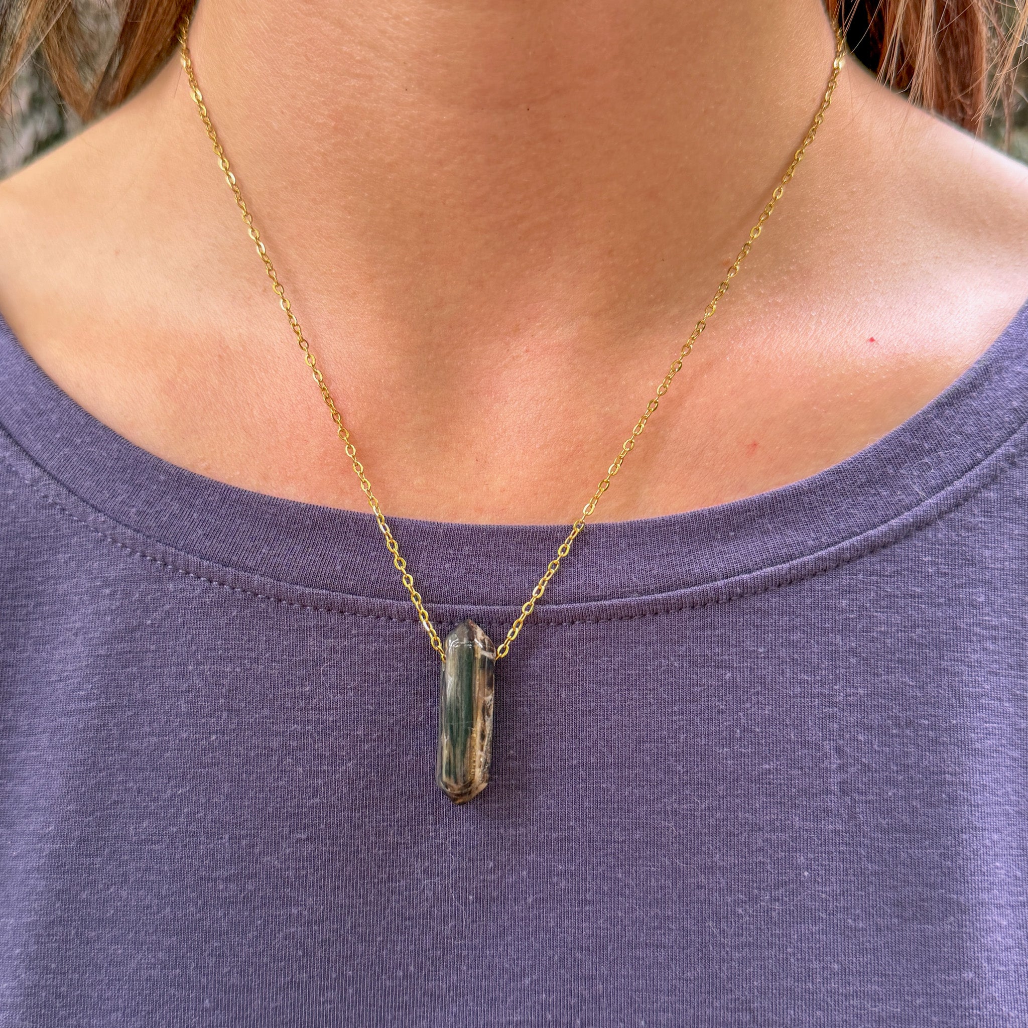 Model wearing Woodlands one-of-a-kind Petrified Wood Agate Point Necklace on gold stainless steel chain