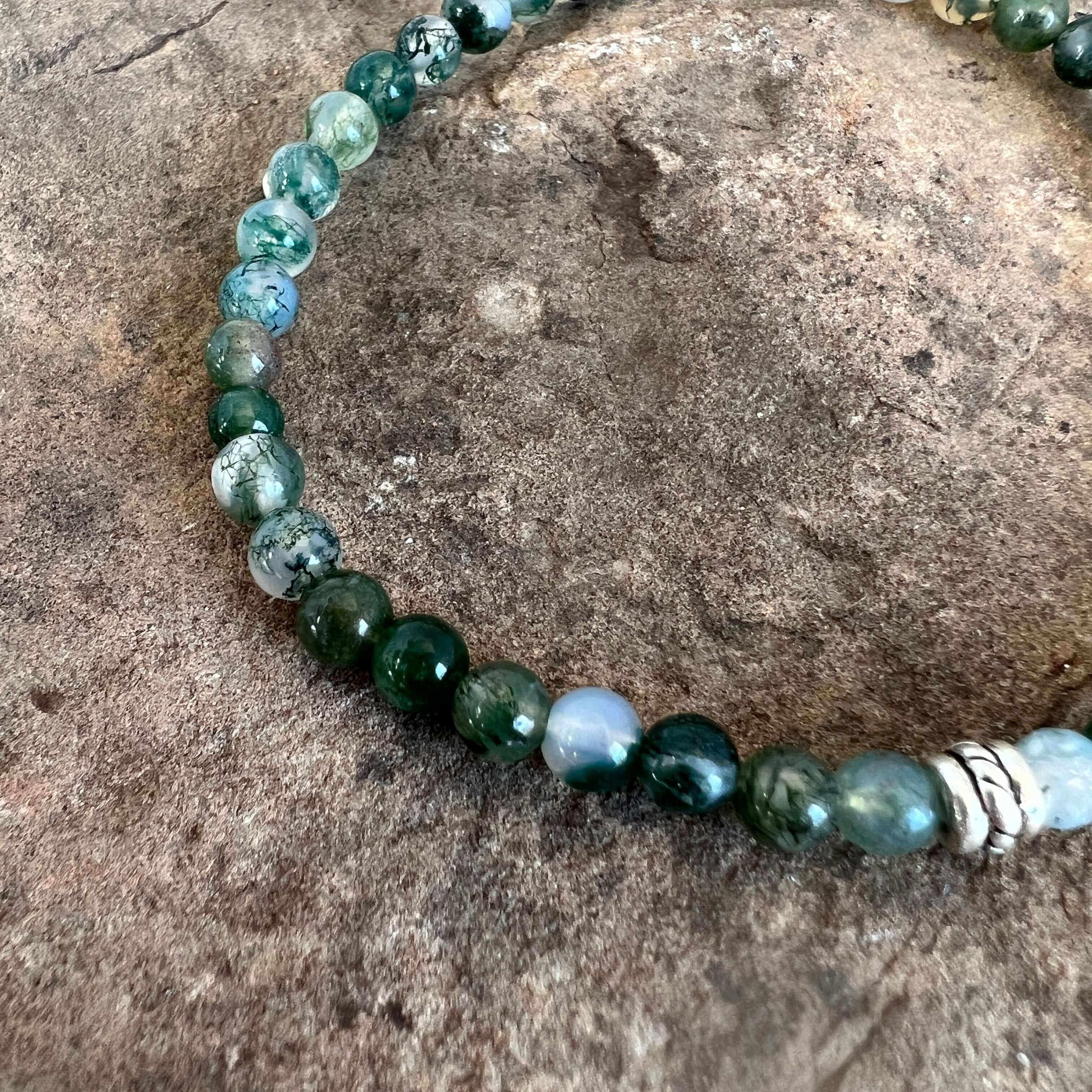 Moss Agate Bracelet This bracelet is made with high-quality Moss Agate gemstones which bring abundance and grounding energy to the wearer. Zodiac Sign: Virgo. Chakra: Heart. Handmade with authentic crystals & gemstones in Minneapolis, MN.