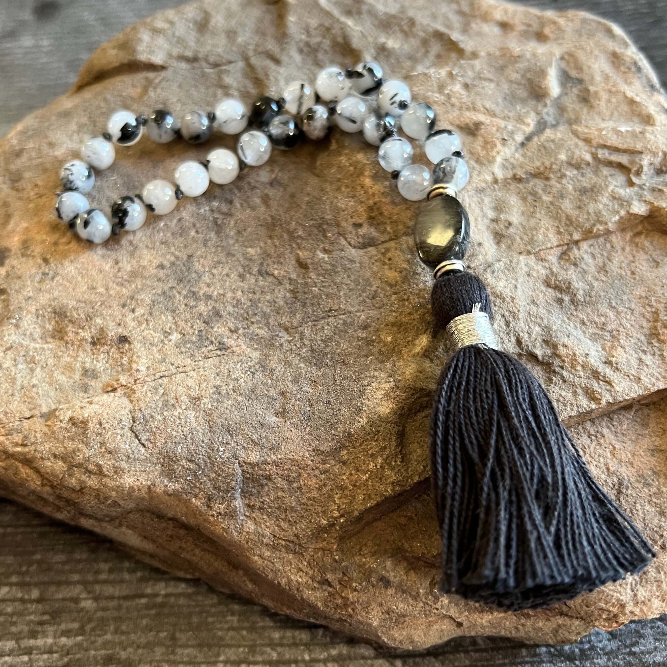 Tourmaline Quartz Wrist Mala These quarter malas are made with high-quality Tourmaline Quartz and Jasper gemstones which bring protection and tranquility to the wearer. Jasper is known as the “supreme nurturer.” Zodiac Signs: Libra, Scorpio, and Leo. Chak