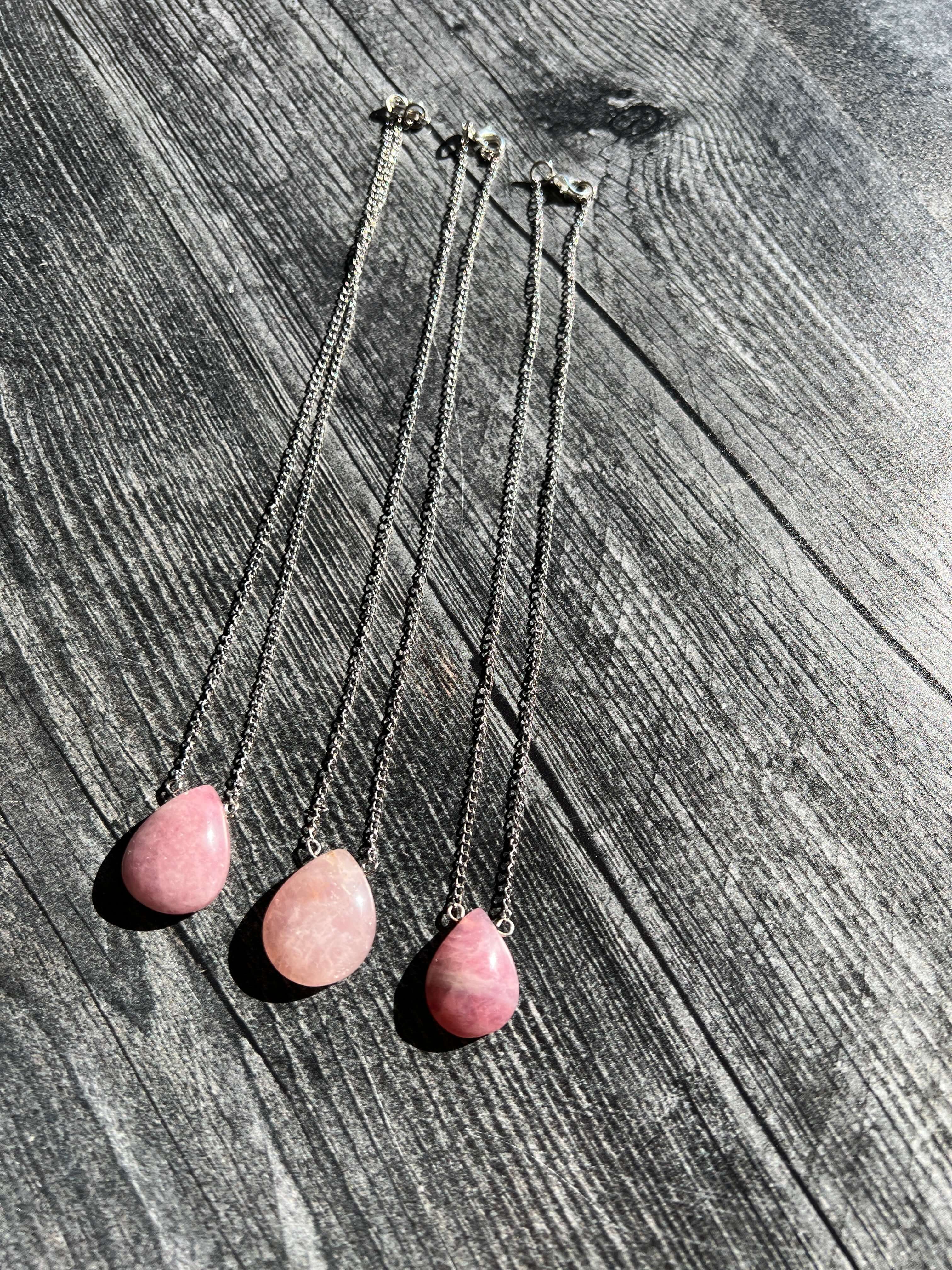 Madagascar Rose Quartz Pendant Necklace This necklace is made with an authentic Madagascar Rose Quartz stone, which serves to inspire and enhance feelings of unconditional love. Zodiac Signs: Aquarius, Pisces, Aries, and Taurus. Chakras: Heart. Handmade w