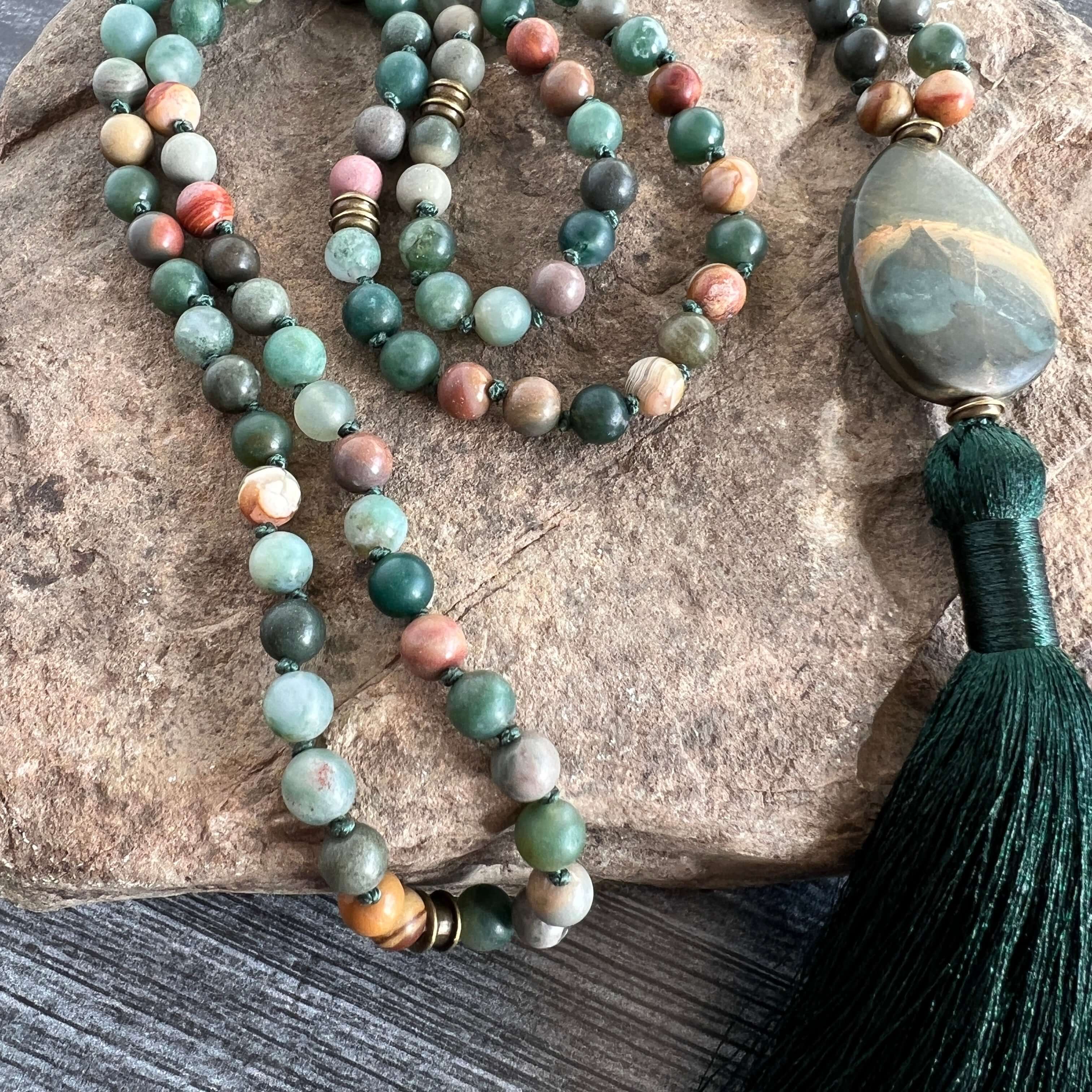Forest Walk Mala This mala is made with high-quality Agate and Jasper gemstones which bring strength and tranquility to the wearer. Zodiac Signs: Leo, Gemini, Aries, Scorpio, and Virgo. Chakras: Third Eye, Root, Crown, and Heart. Handmade with authentic c