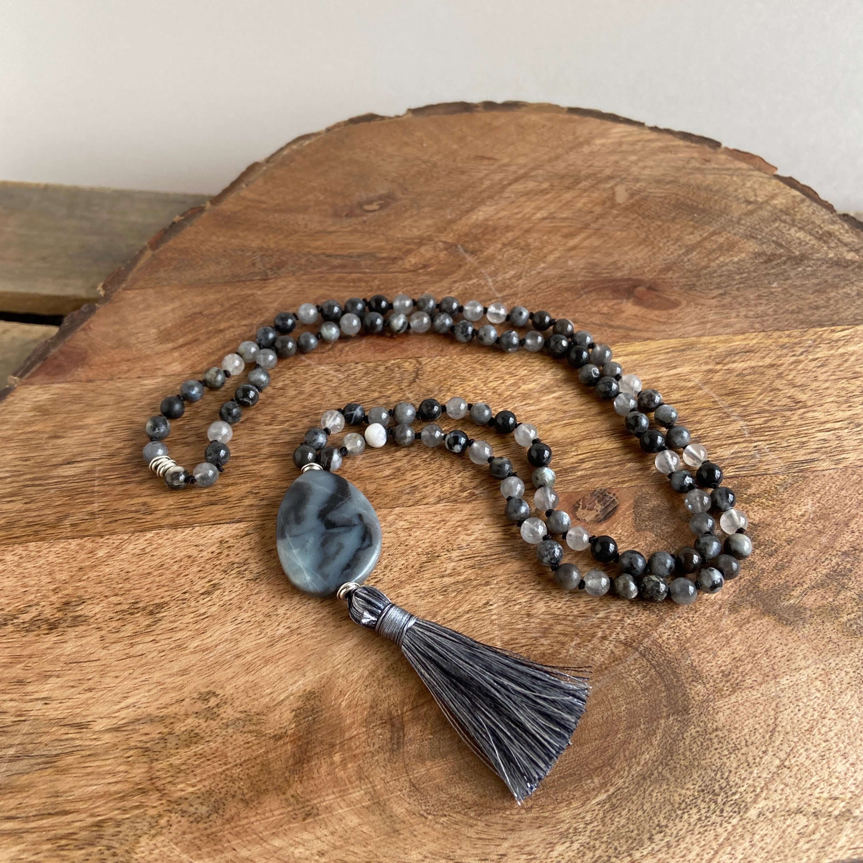 Transformation Mala This mala is made with 6mm Blue Labradorite, Cloud Quartz, and Amazonite beads. The guru stone is Amazonite. It is strung on black nylon thread and hand knotted between each stone. Blue Labradorite is a stone of transformation and chan