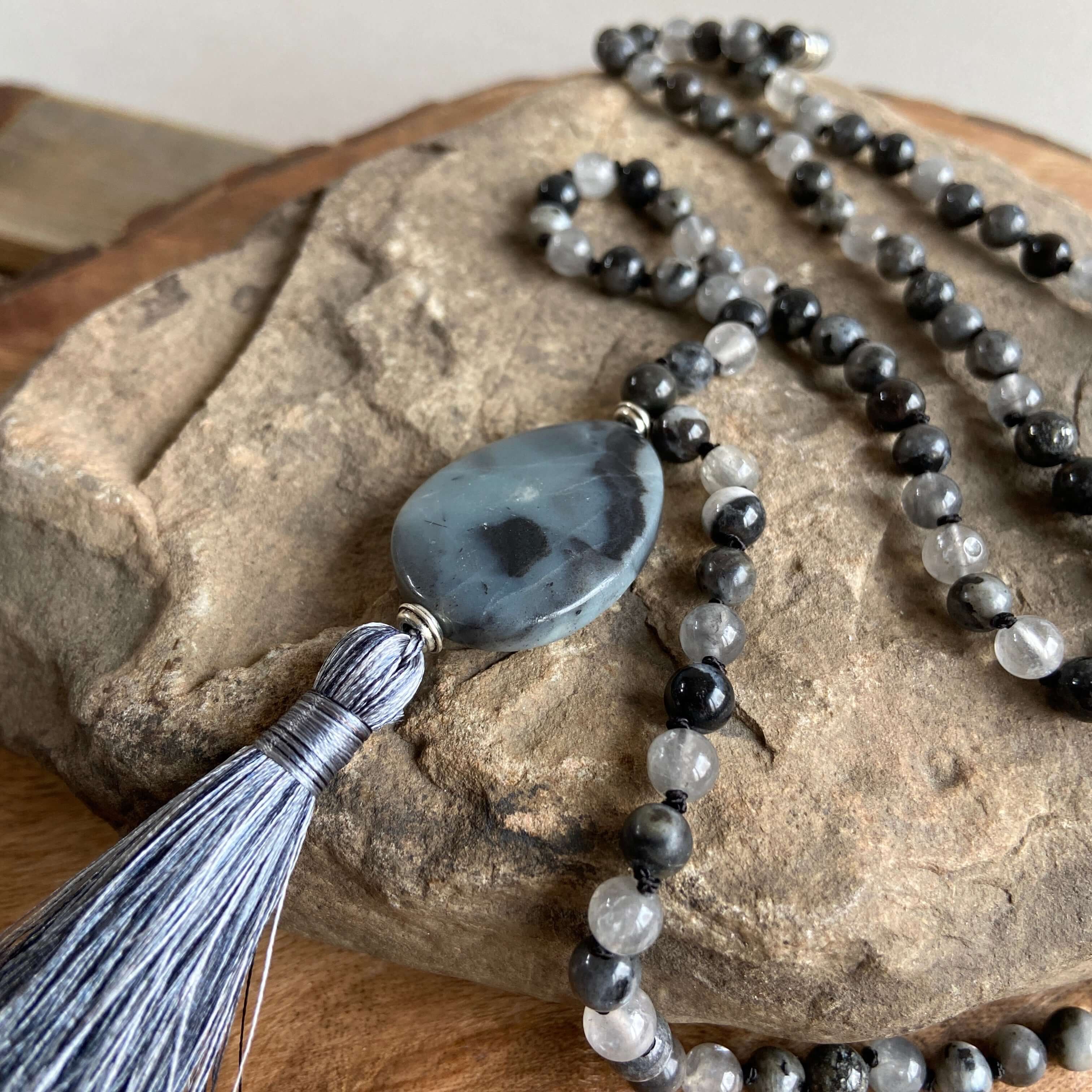 Transformation Mala This mala is made with 6mm Blue Labradorite, Cloud Quartz, and Amazonite beads. The guru stone is Amazonite. It is strung on black nylon thread and hand knotted between each stone. Blue Labradorite is a stone of transformation and chan