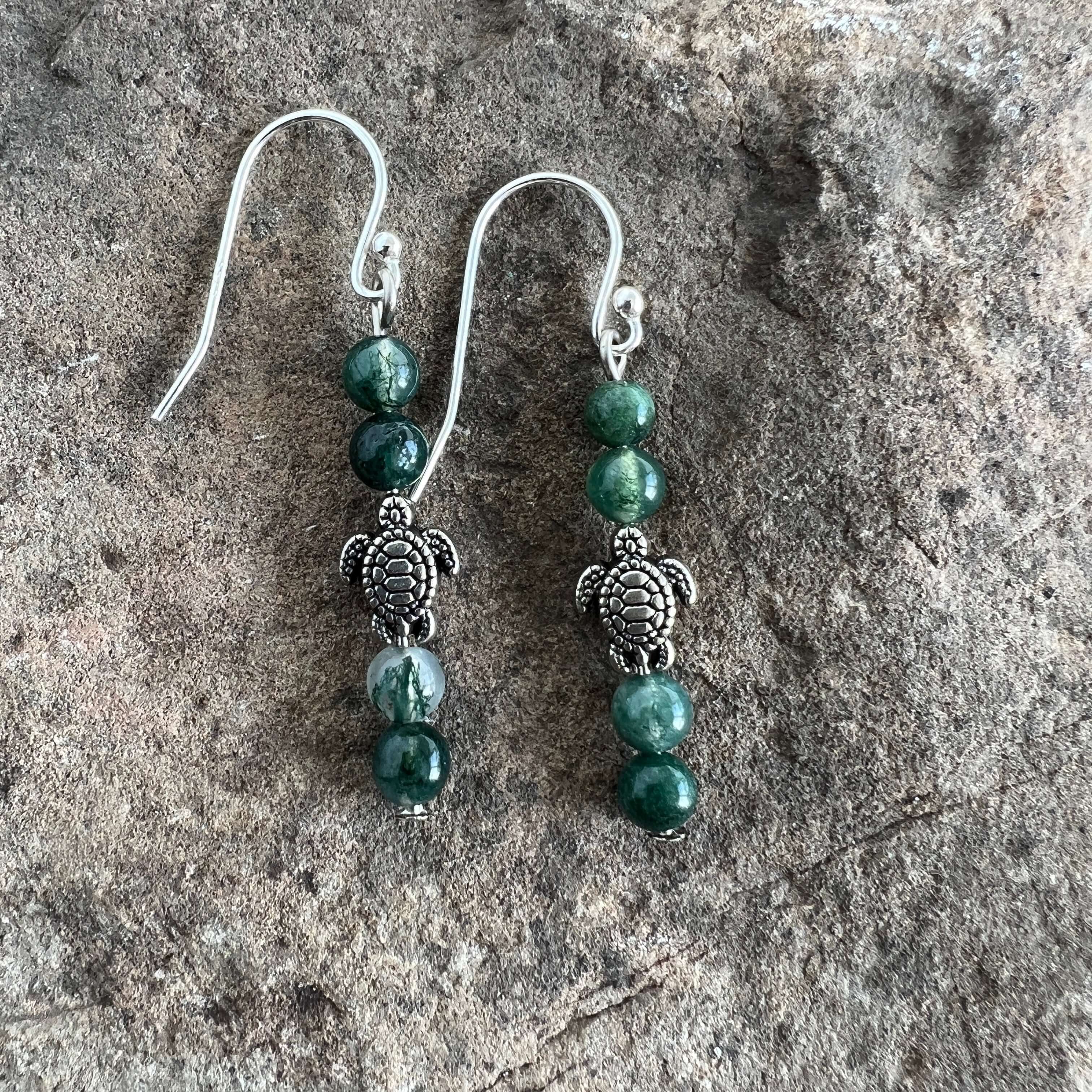 Turtle Charm Earrings These earrings are made with high-quality Moss Agate gemstones which bring abundance and grounding energy to the wearer. Turtle symbolism includes longevity, perseverance, steadfastness, protection, retreat, healing, tranquility, the