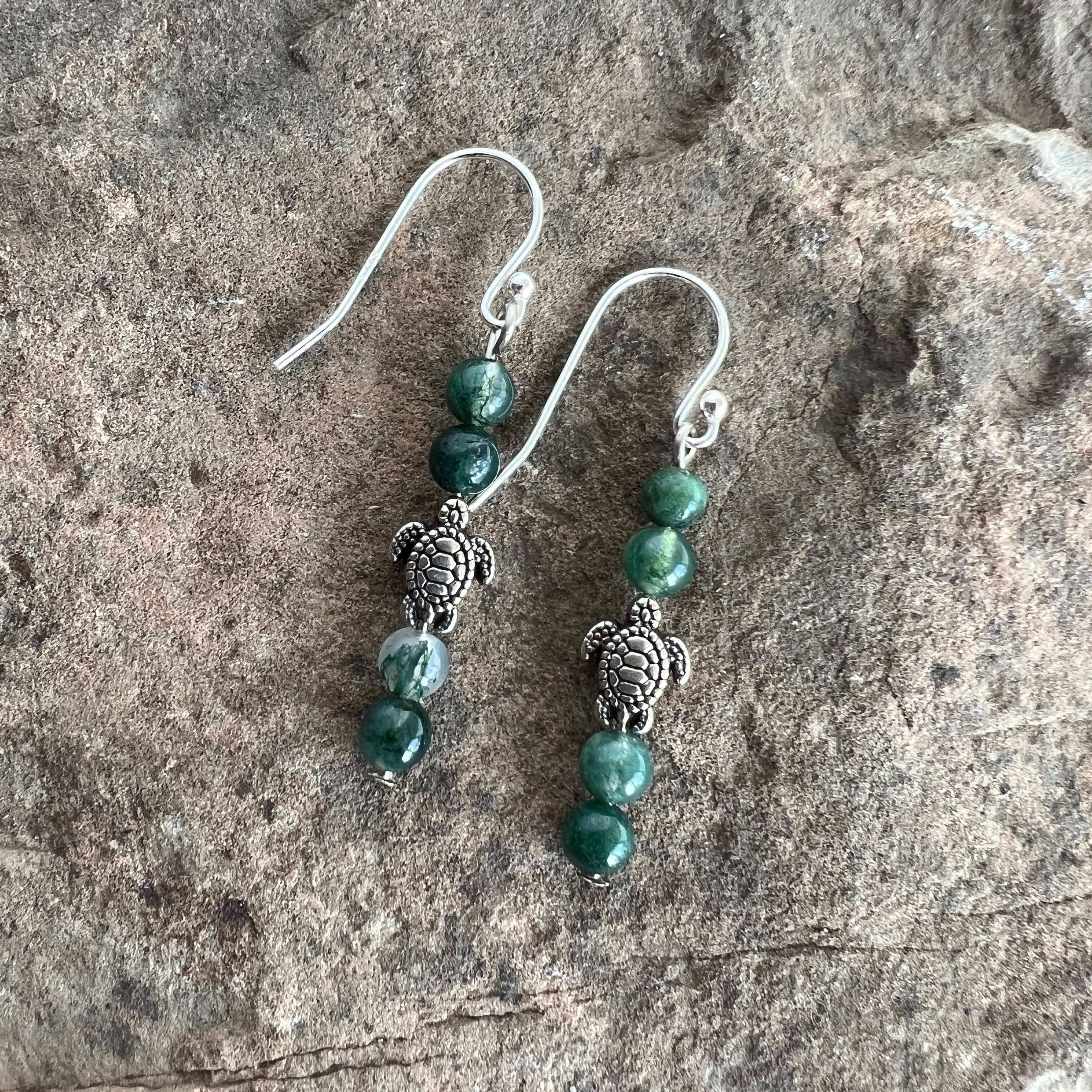 Turtle Charm Earrings These earrings are made with high-quality Moss Agate gemstones which bring abundance and grounding energy to the wearer. Turtle symbolism includes longevity, perseverance, steadfastness, protection, retreat, healing, tranquility, the