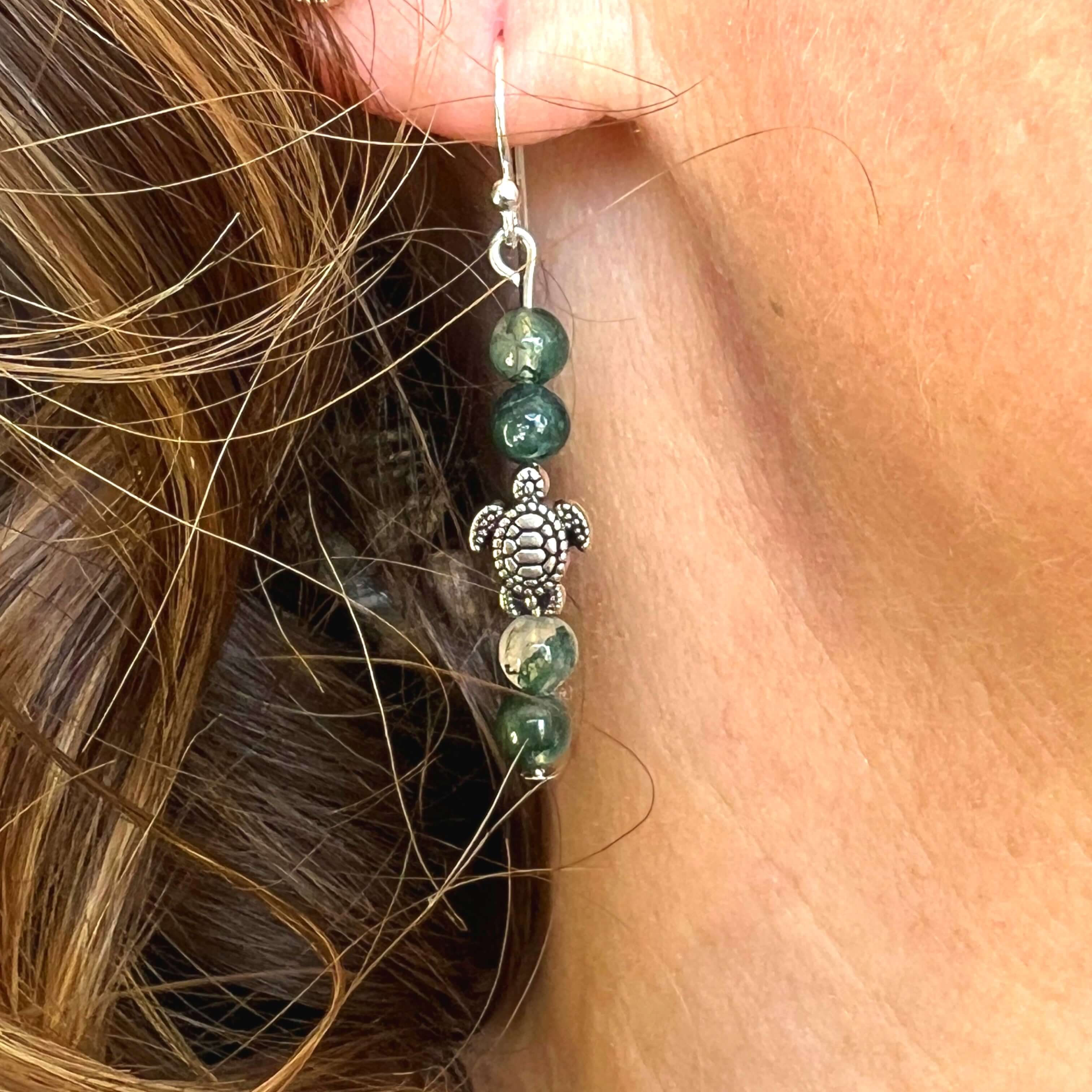 Turtle Charm Earrings These earrings are made with high-quality Moss Agate gemstones which bring abundance and grounding energy to the wearer. Turtle symbolism includes longevity, perseverance, steadfastness, protection, retreat, healing, tranquility, the