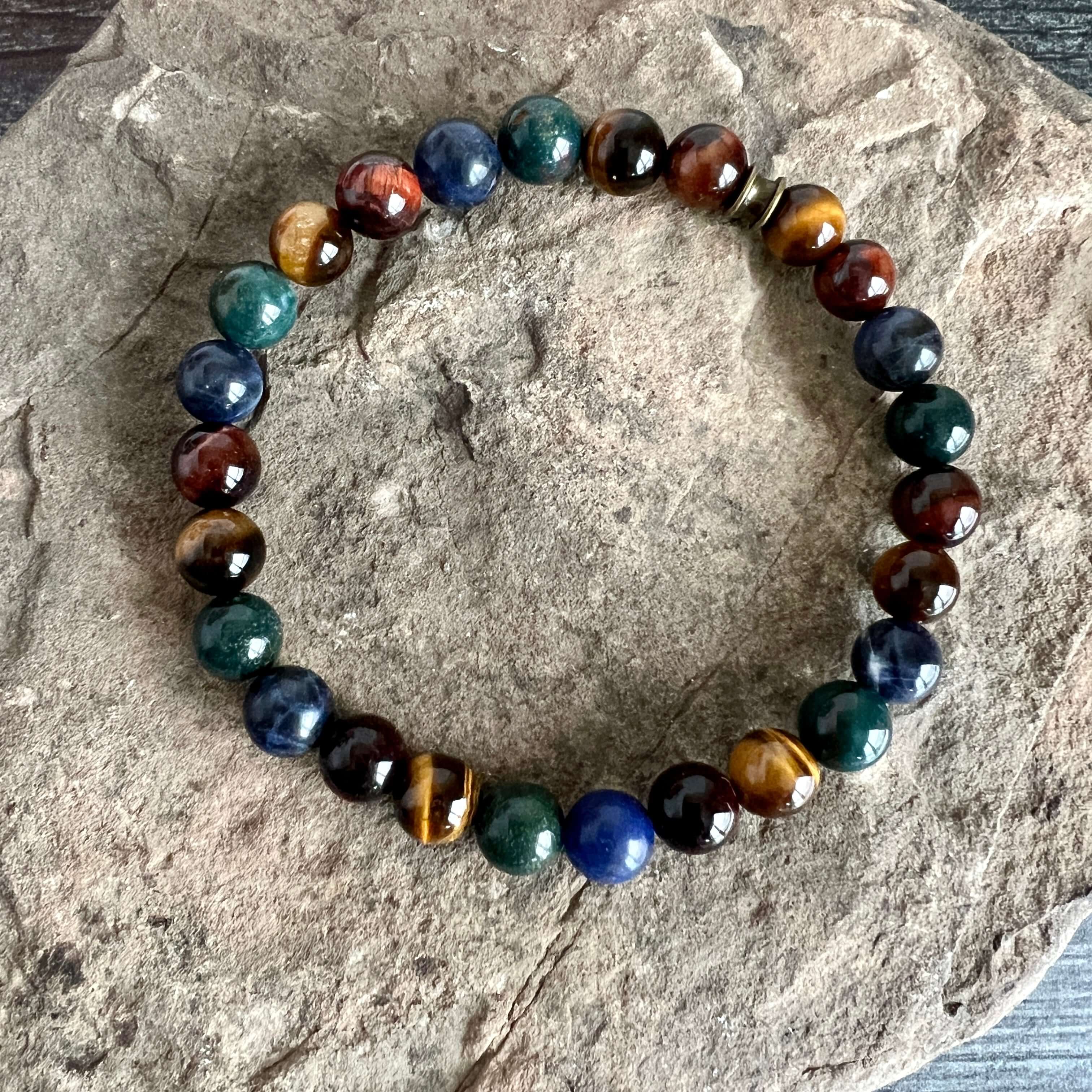 Deep Woods Bracelet This bracelet is made with two types of Tiger Eye stones, along with Bloodstone and Sodalite. Brought together, this creates a very rooted and grounded energy, allowing the wearer to be clear minded, as well as feeling very secure and