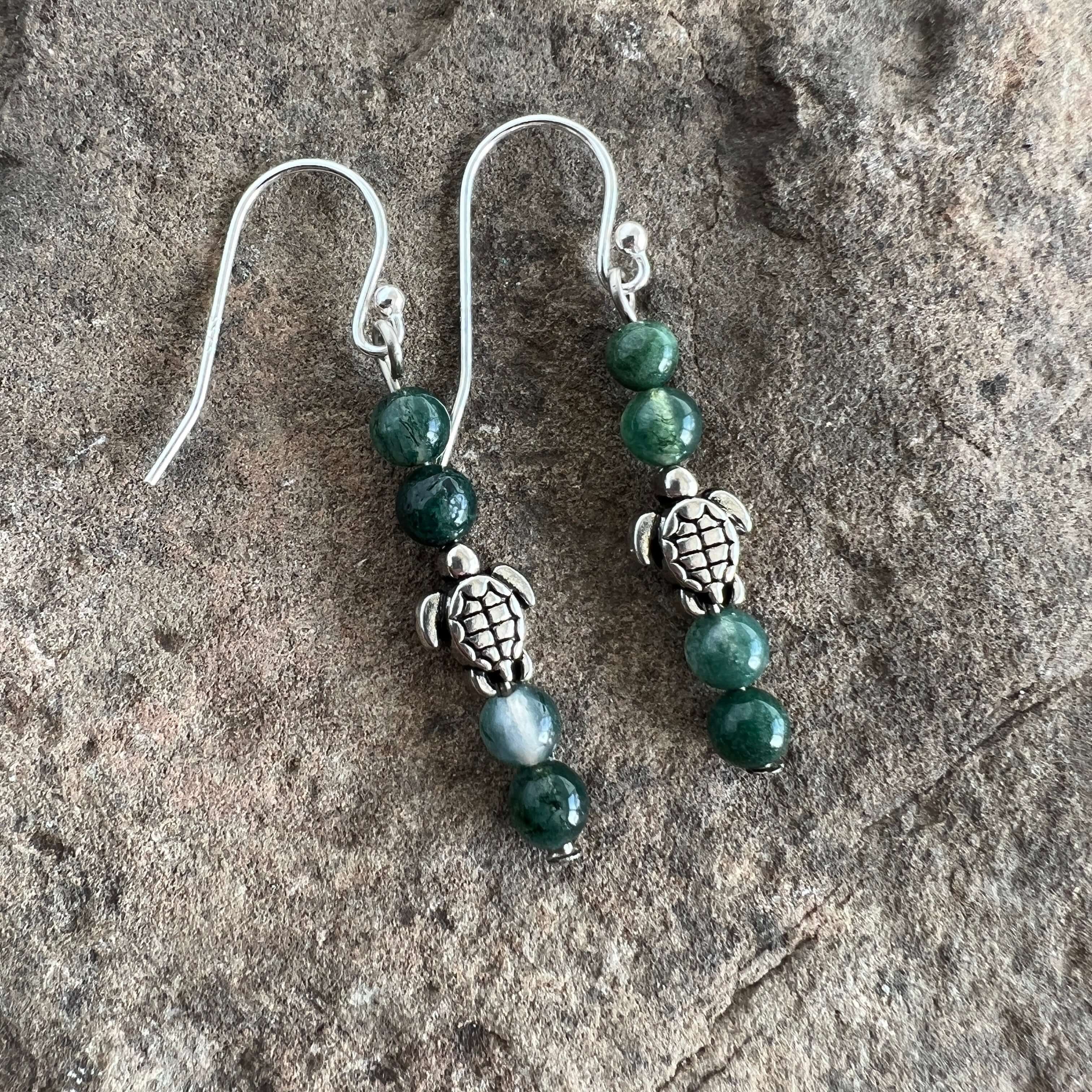 Turtle Charm Earrings These earrings are made with high-quality Moss Agate gemstones which bring abundance and grounding energy to the wearer. Turtle symbolism includes longevity, perseverance, steadfastness, protection, retreat, healing, tranquility, the