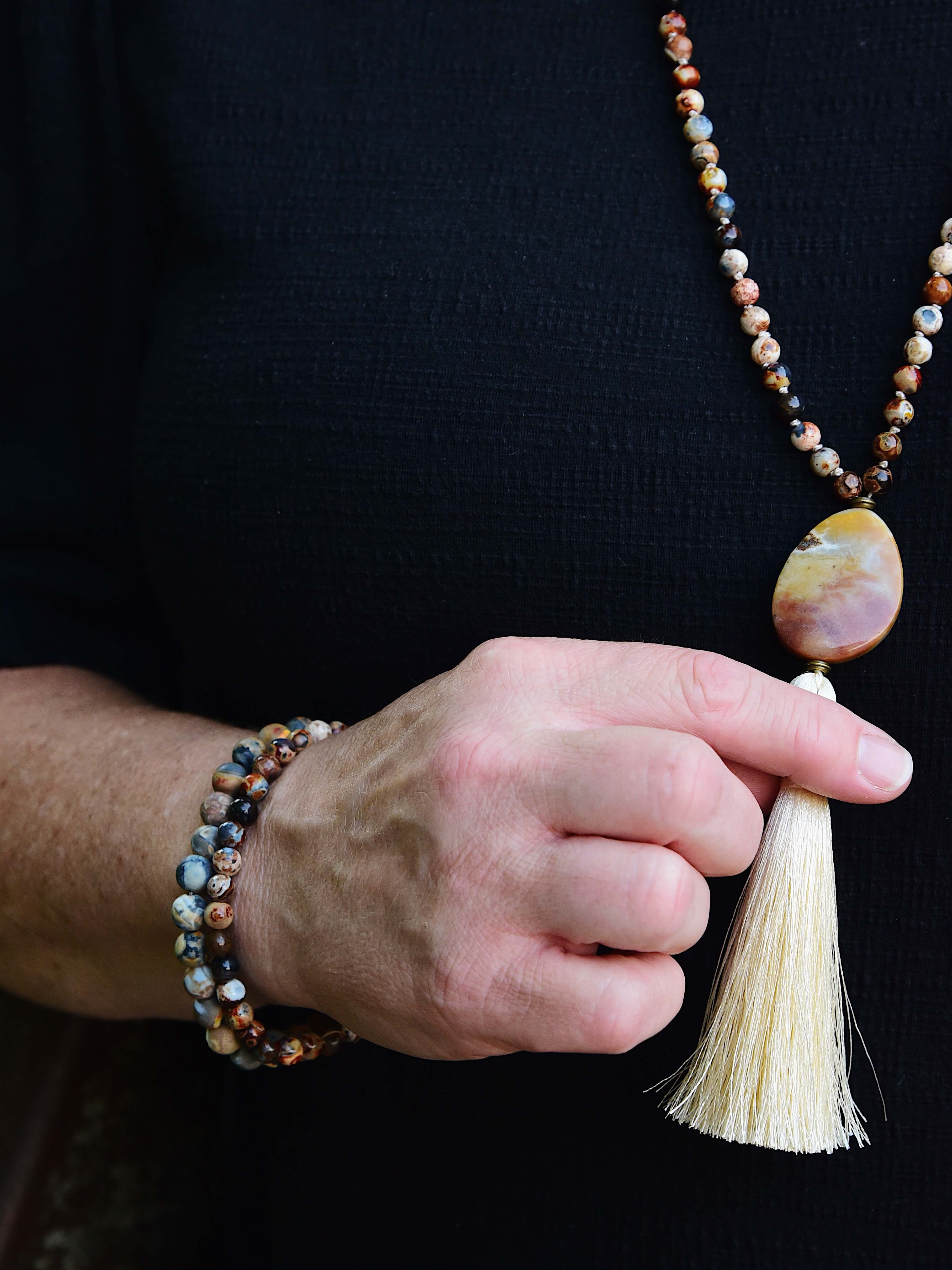 Ancient Cellar Black Agate Mala This mala is made with high-quality Ancient Cellar Agate & Amazonite stones which provide grounding, calmness and strength to its wearer.