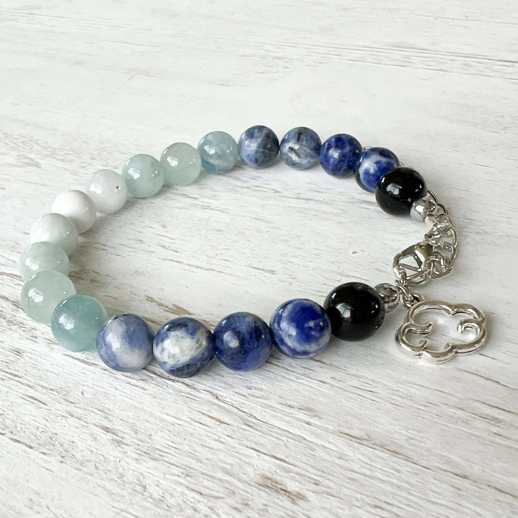 Air Element Bracelet This bracelet is made with Black Obsidian, Sodalite, and Aquamarine to represent the air element. These stones bring the wearer heightened intuition, calmness, and mental clarity.