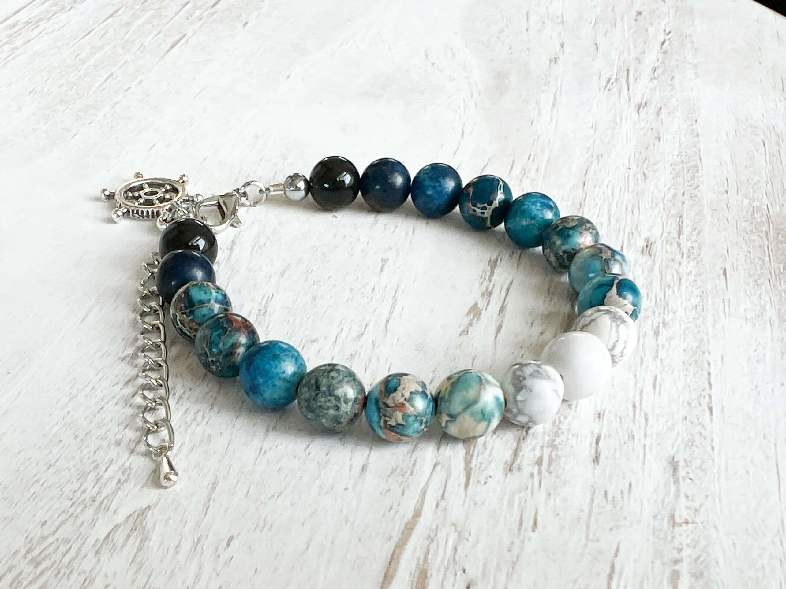 Water Element Bracelet This bracelet is made with black obsidian, dyed sea sediment jasper, and howlite. Together these stones dispel negative energy and open the wearer to emotional healing.