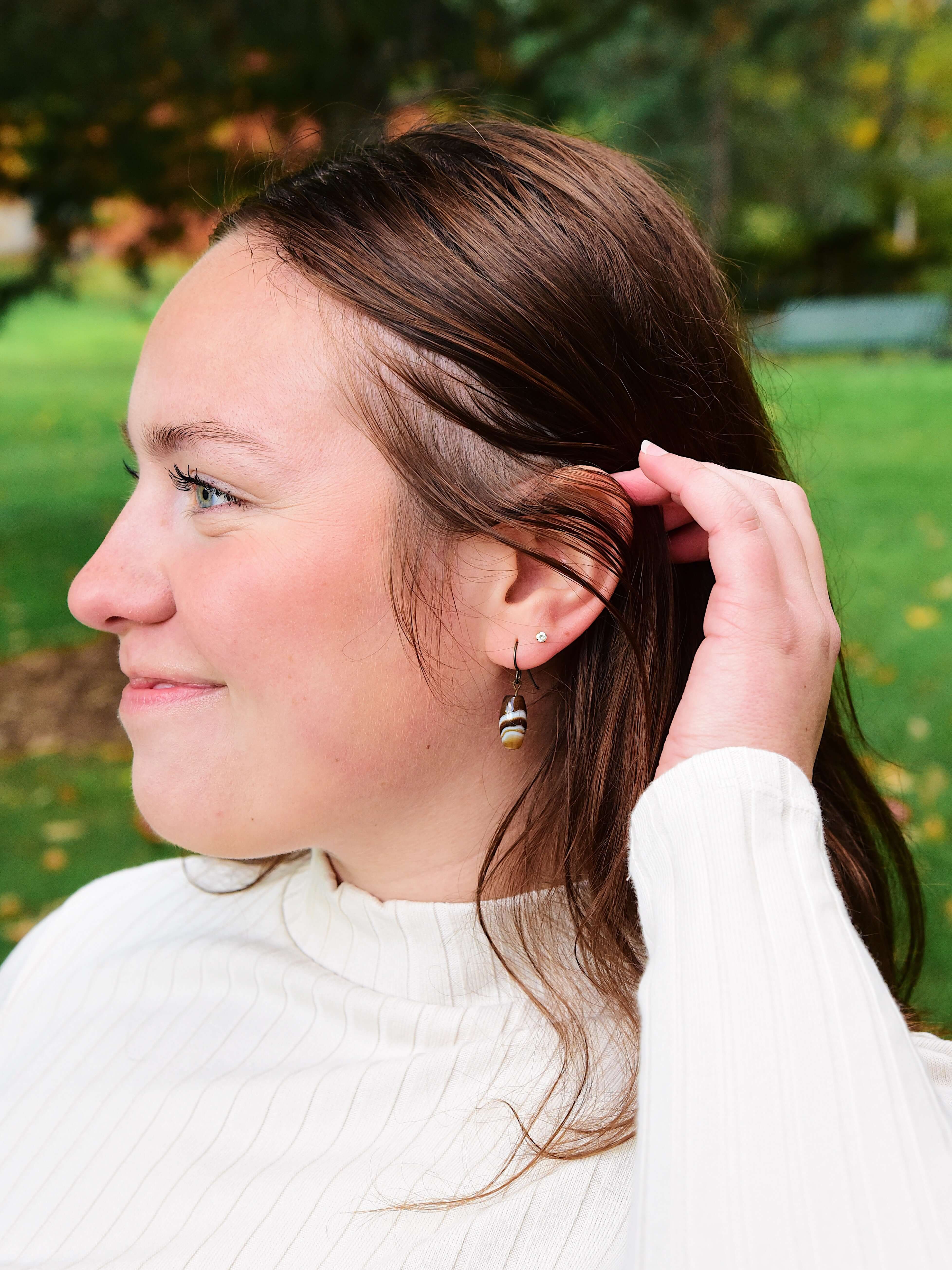 Tibetan Agate Earrings These earrings are made with authentic Tibetan Agate gemstones, which is believed to bestow its wearer with a sense of balance and protection, shielding you from negative energies while enhancing your inner strength and resilience.