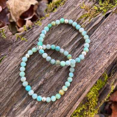 Russian Amazonite Bracelet This bracelet is made with high-quality Russian Amazonite stones which bring balance and inspiration to the wearer. Zodiac: Virgo Chakras: Heart & Throat. Handmade with authentic crystals and gemstones.