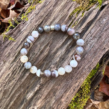 Load image into Gallery viewer, Botswana Agate Bracelet This bracelet is made from authentic Botswana Agate gemstones which bring comfort and hope to the wearer. Zodiac Signs: Gemini. Chakras: Root. Handmade with authentic crystals and gemstones in Minneapolis, MN.

