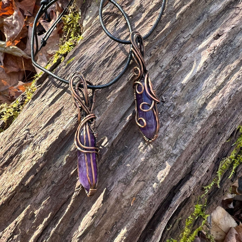 Amethyst Double Point Wire Wrapped Pendant This pendant is made with a hexagonal double pointed Amethyst stone and solid copper wire that has a patina for an antiqued look. Amethyst brings the wearer a sense of calmness and clarity. Amethyst is the births