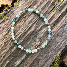 Load image into Gallery viewer, Dappled Sunlight Bracelet This bracelet is made with high-quality Moss Agate, Green Aventurine, Aquamarine, Cloud Quartz &amp; Wood Opal stones which bring abundance and calm to the wearer. Zodiac: Virgo, Taurus, Pisces, Aries, Aquarius &amp; Leo Chakras: Heart,
