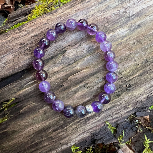 Amethyst Bead Bracelet This bracelet is made with high-quality Amethyst stones which bring serenity to the wearer. Zodiac: Aquarius. Chakras: Third Eye and Crown. Birthstone: February. Handmade with authentic crystals and gemstones in Minneapolis, MN.