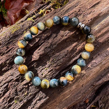 Load image into Gallery viewer, Blue and Blonde Tiger Eye Bead Bracelet This bracelet is made with high-quality Blue and Blonde Tiger Eye stones which bring confidence and optimism to the wearer. Zodiac Signs: Leo and Capricorn. Chakras: Root and Solar Plexus. Handmade with authentic cr
