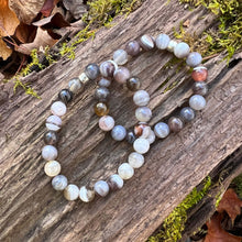 Load image into Gallery viewer, Botswana Agate Bracelet This bracelet is made from authentic Botswana Agate gemstones which bring comfort and hope to the wearer. Zodiac Signs: Gemini. Chakras: Root. Handmade with authentic crystals and gemstones in Minneapolis, MN.
