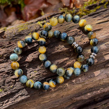 Load image into Gallery viewer, Blue and Blonde Tiger Eye Bead Bracelet This bracelet is made with high-quality Blue and Blonde Tiger Eye stones which bring confidence and optimism to the wearer. Zodiac Signs: Leo and Capricorn. Chakras: Root and Solar Plexus. Handmade with authentic cr
