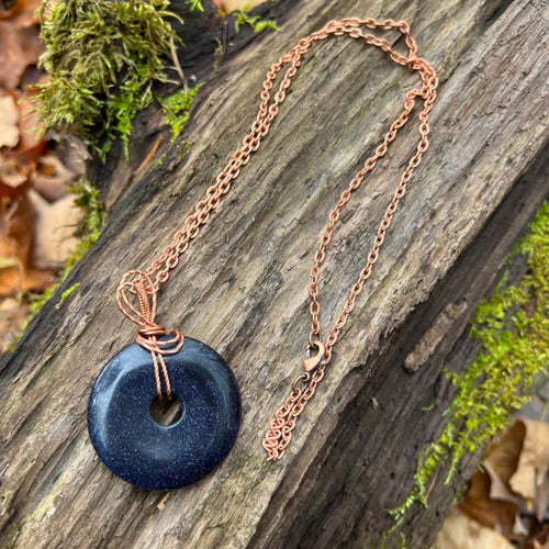 Blue Goldstone Wire Wrapped Pendant Necklace This pendant is made with blue goldstone and solid copper wire. The copper has a coating of Renaissance Wax to help keep the copper bright. Blue goldstone helps the wearer embrace their true selves, promotes vi
