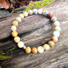 Load image into Gallery viewer, Crazy Lace Agate Bead Bracelet This bracelet is made with high-quality Crazy Lace Agate stones which bring optimism to the wearer. Zodiac Sign: Gemini. Chakras: Third Eye and Crown. Handmade with authentic crystals and gemstones in Minneapolis, MN.
