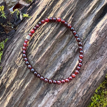 Load image into Gallery viewer, Garnet Bead Bracelet This bracelet is made with high-quality Garnet stones which bring hope and courage to the wearer. Zodiac Signs: Aquarius, Aries, Sagittarius, Leos and Capricorn. Chakras: Sacral, Root. Birthstone: January. Anniversary: 2nd. Handmade w
